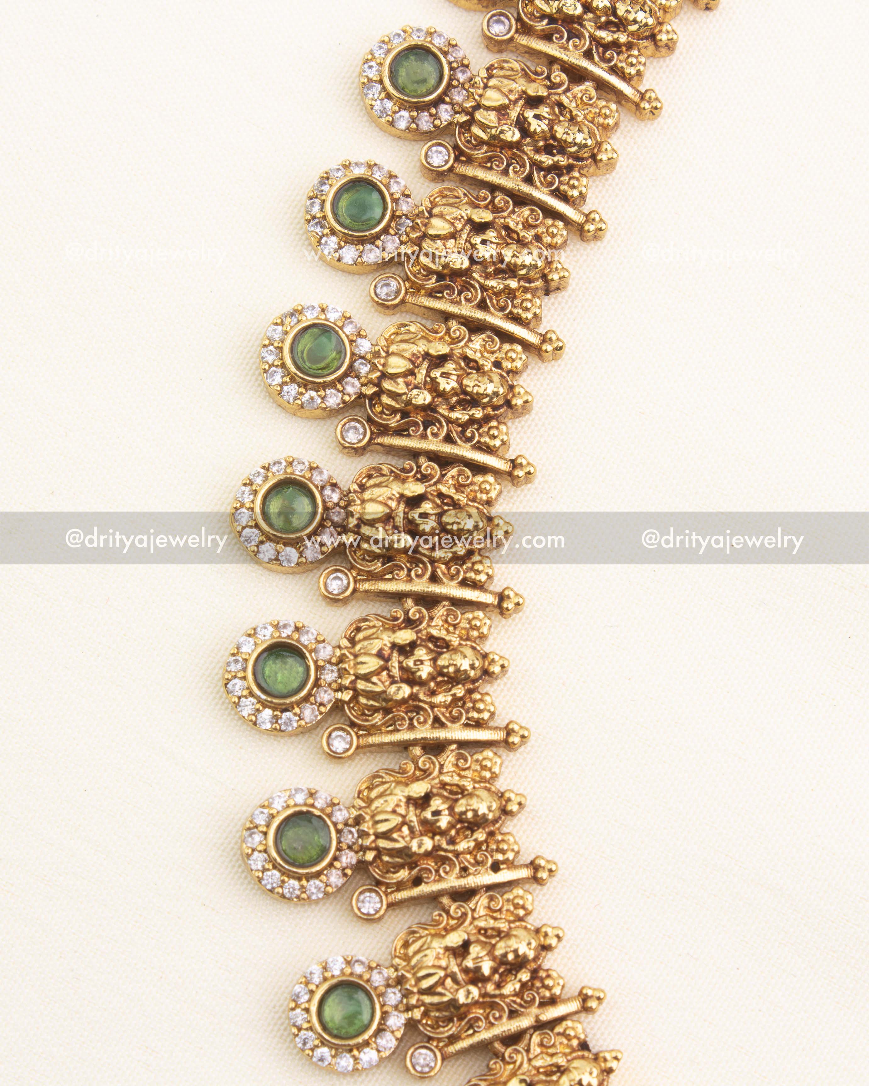 Close-up of green stone temple choker with Lakshmi carvings