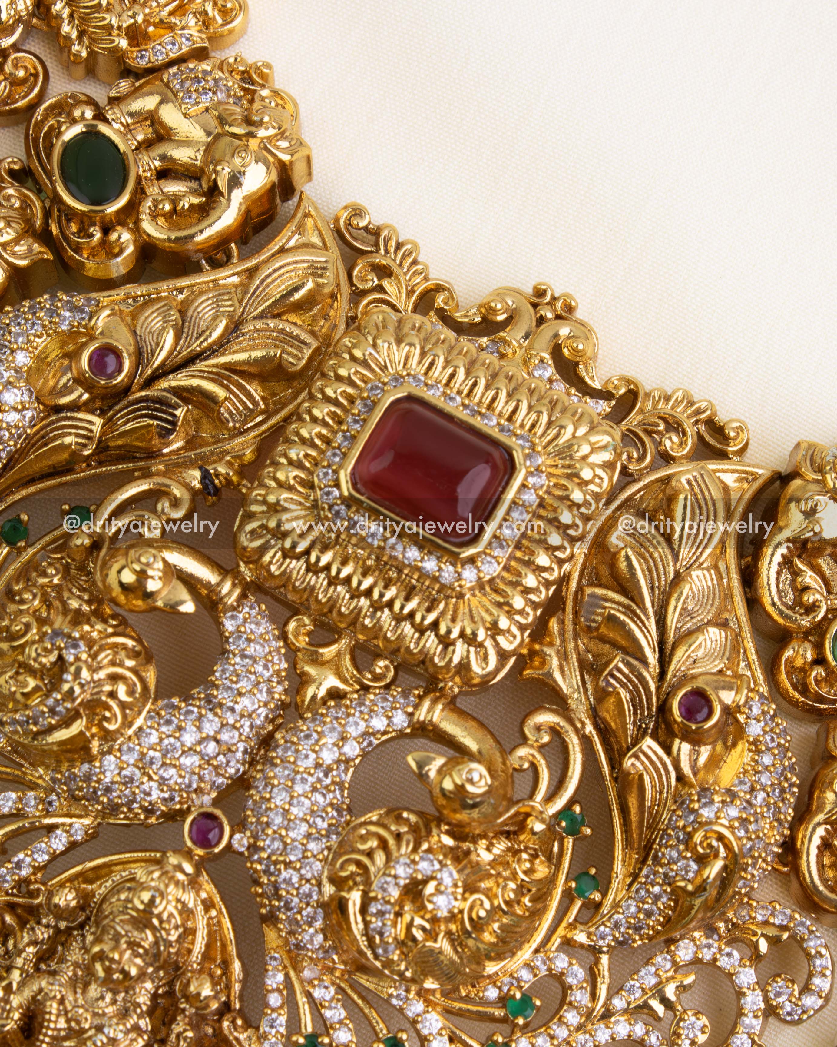 Highlight of ruby centerpiece and surrounding intricate nakshi patterns.