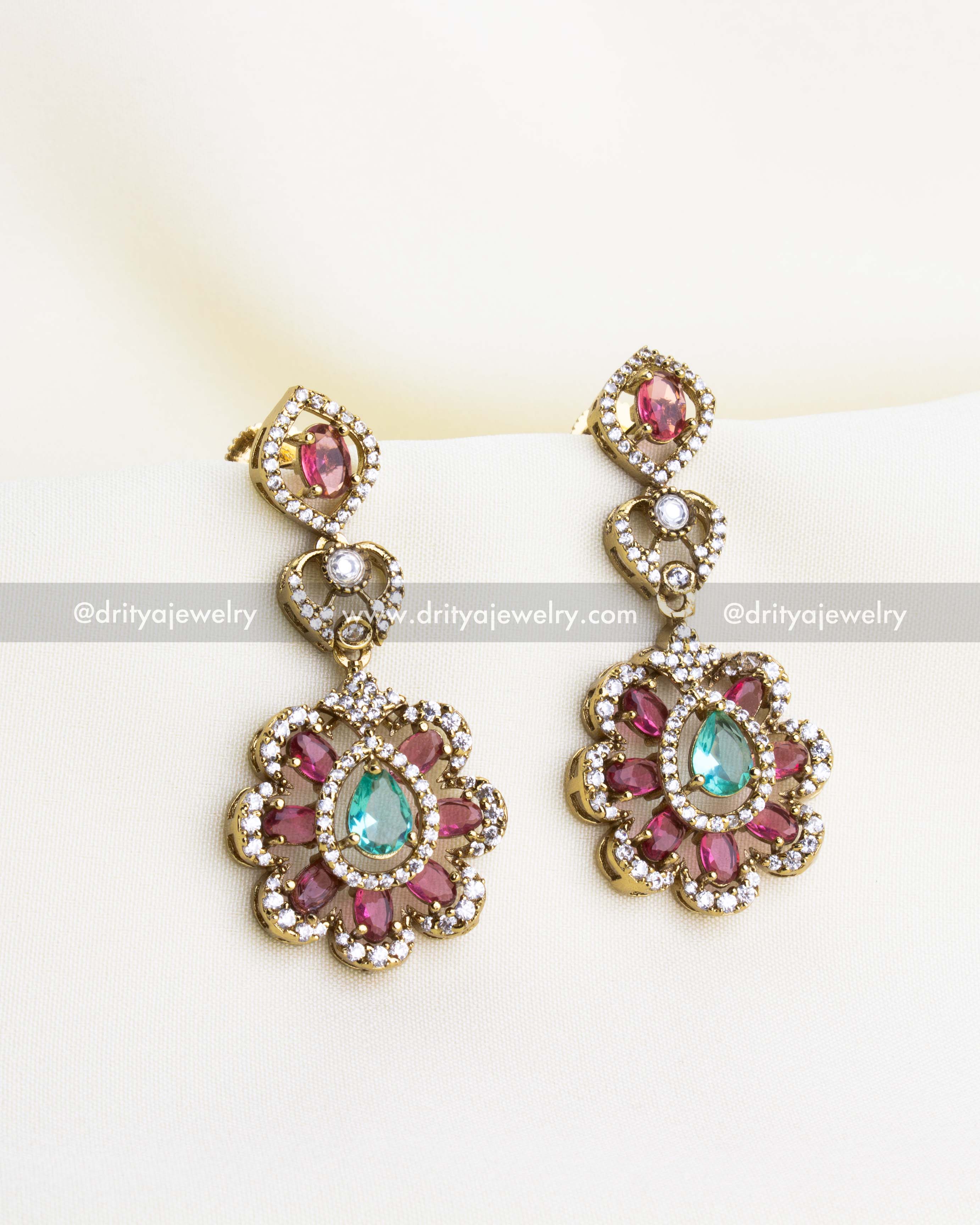 SKU 1135 - Necklace Set - Close-up front view of emerald and pink stone drop earrings