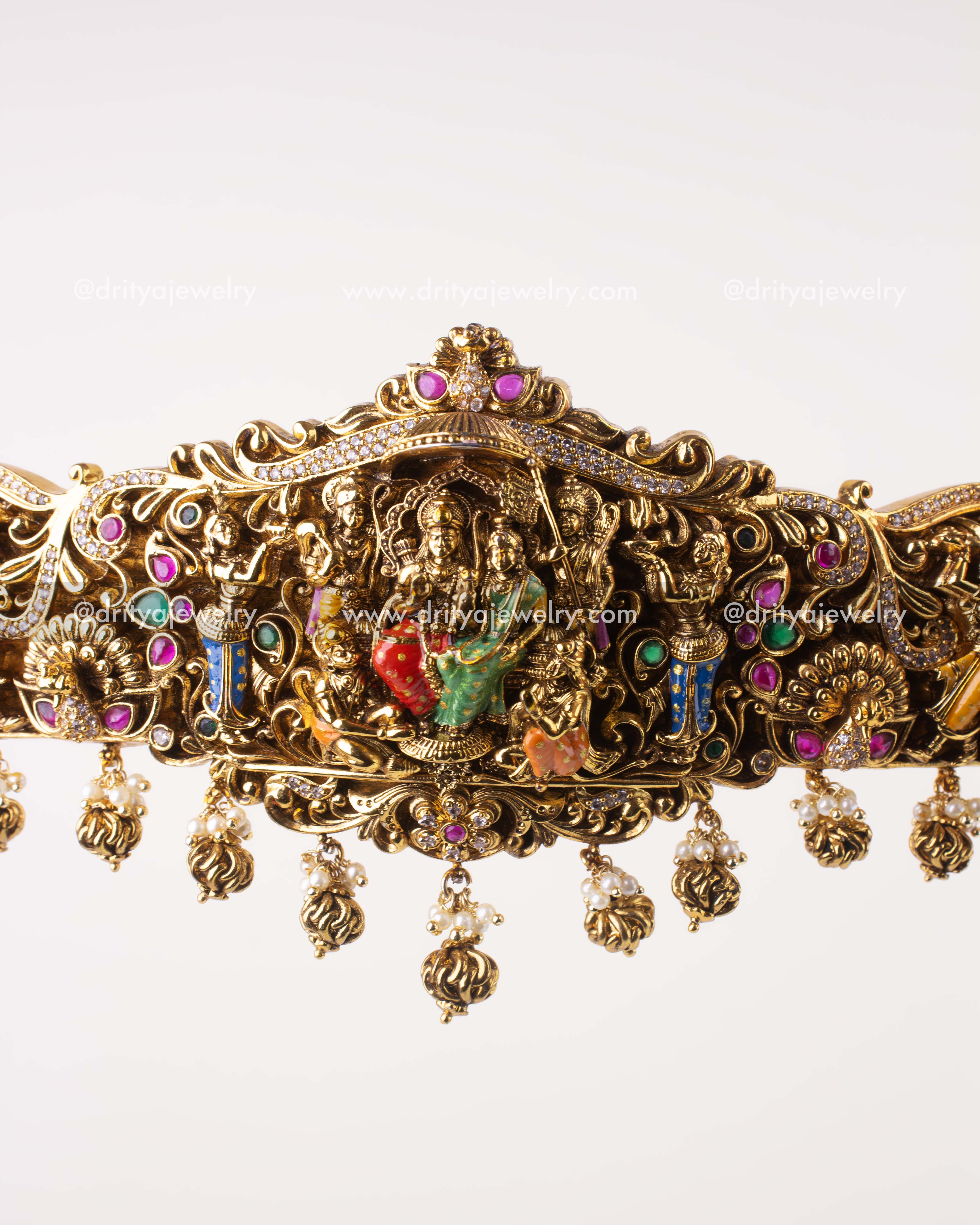 1206 - Close-up of central Ram Parivar idol with meenakari and pearl drops on waist belt