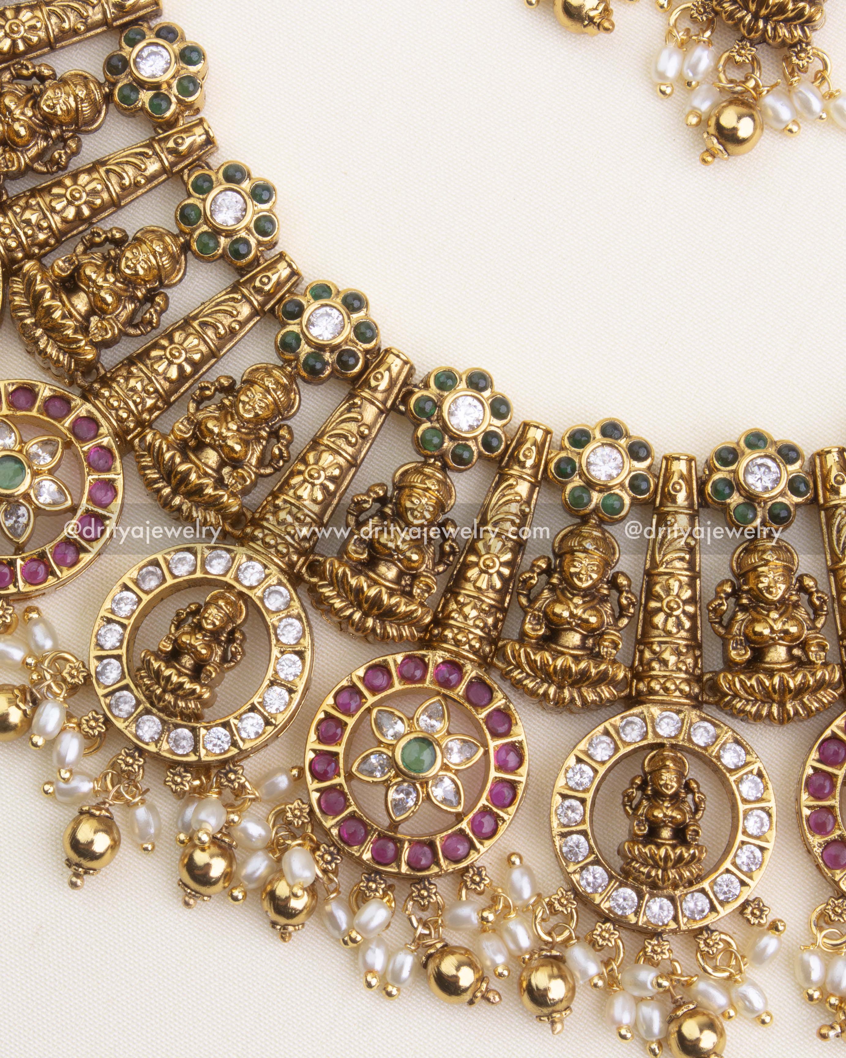 1194 - Close-up of temple necklace butta mala design with god idol and circular pendants