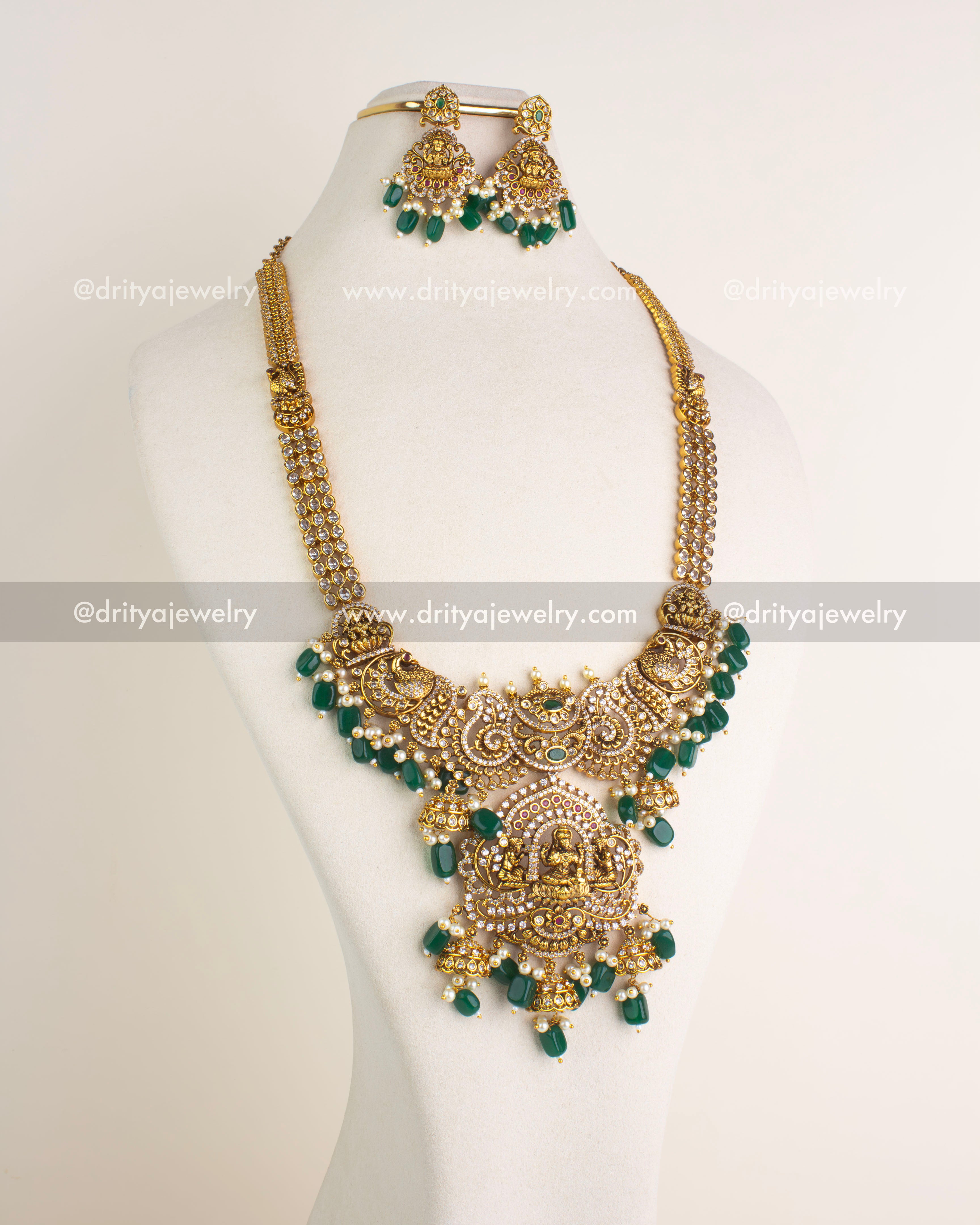 SKU 1161 Necklace Set front view showing full temple haram with deity pendant and matching earrings on bust