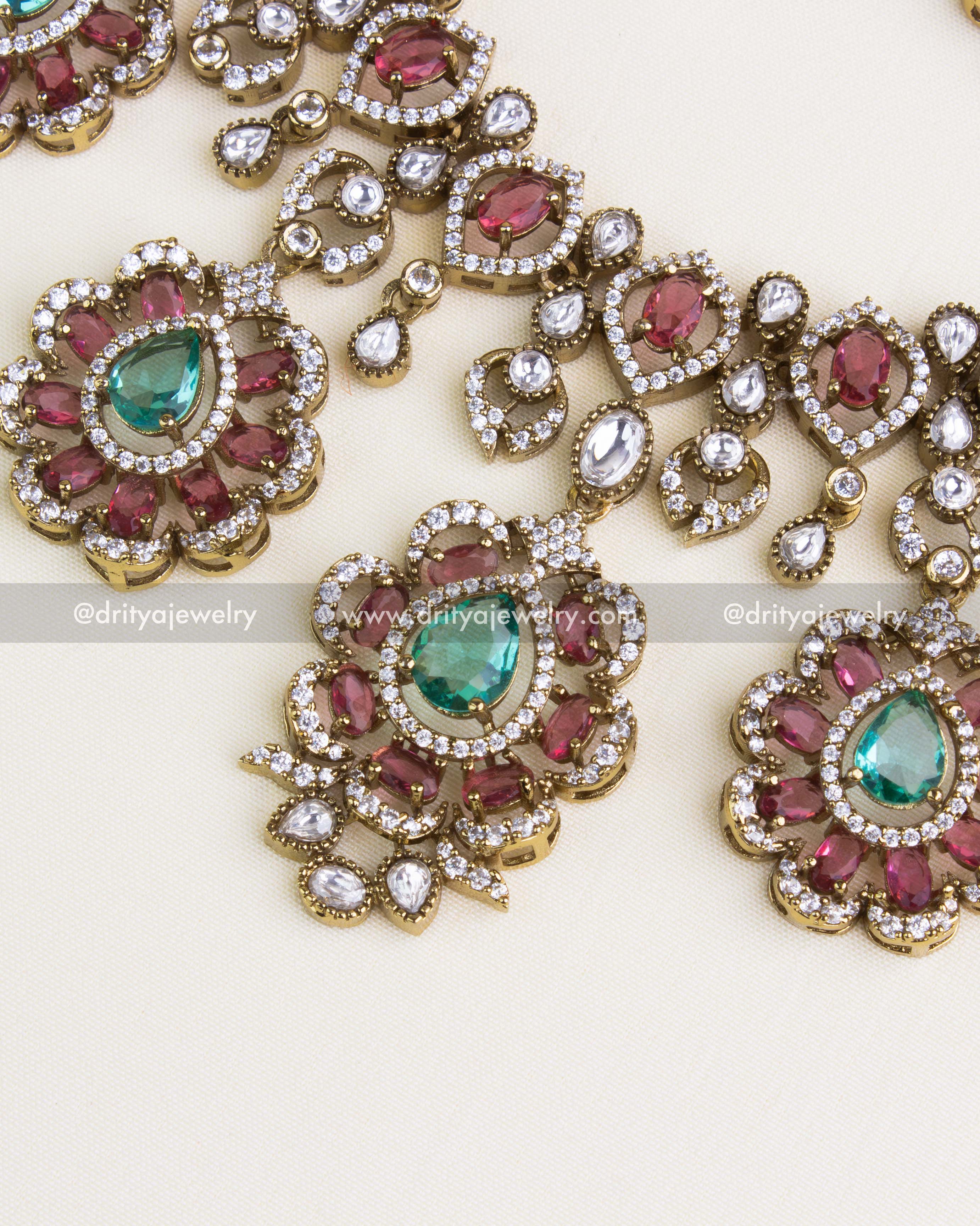 SKU 1135 - Necklace Set - Detailed view of central necklace pendants with emerald centres