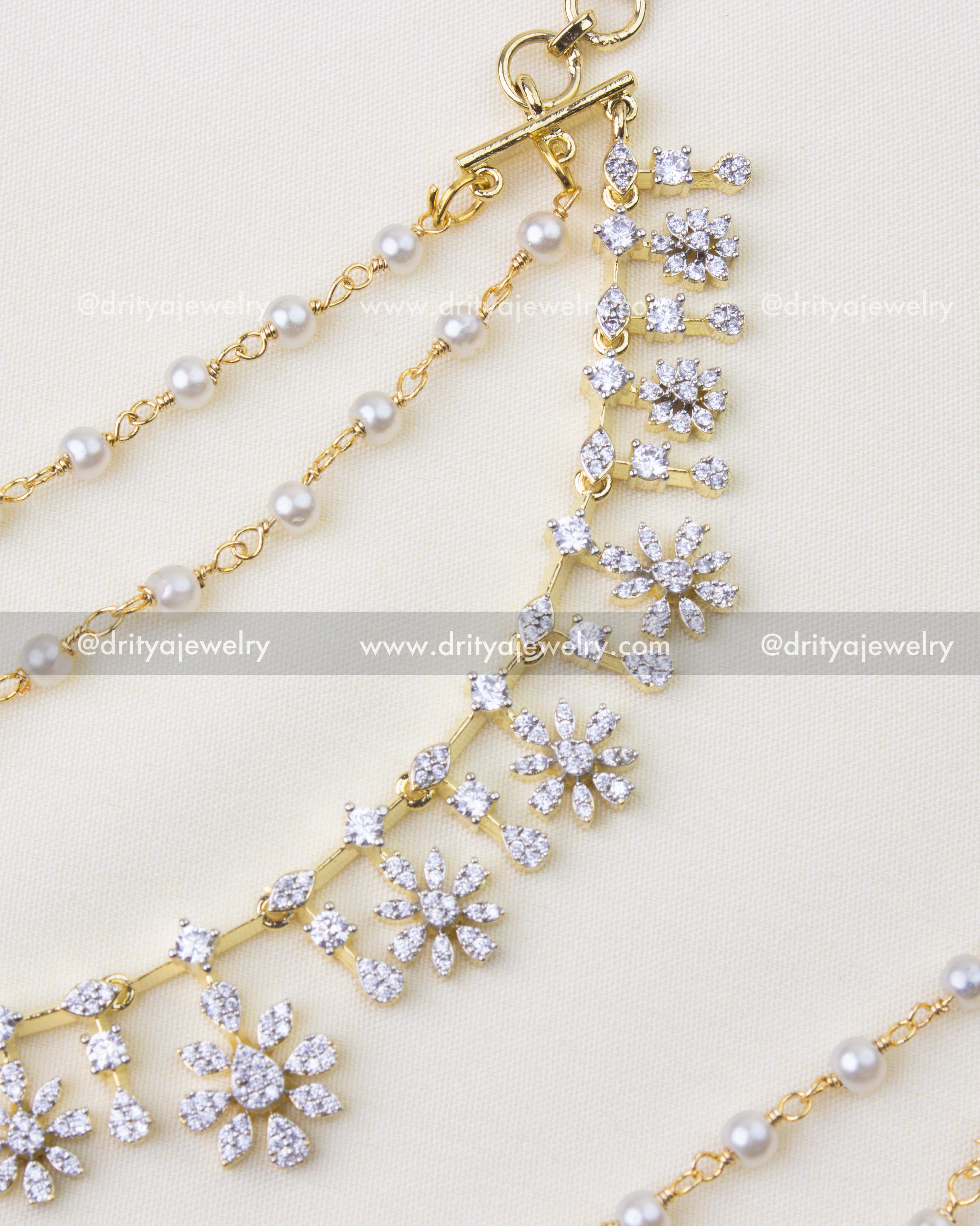 1231 - Close-up of CZ floral champaswaralu hair chain with pearl lines