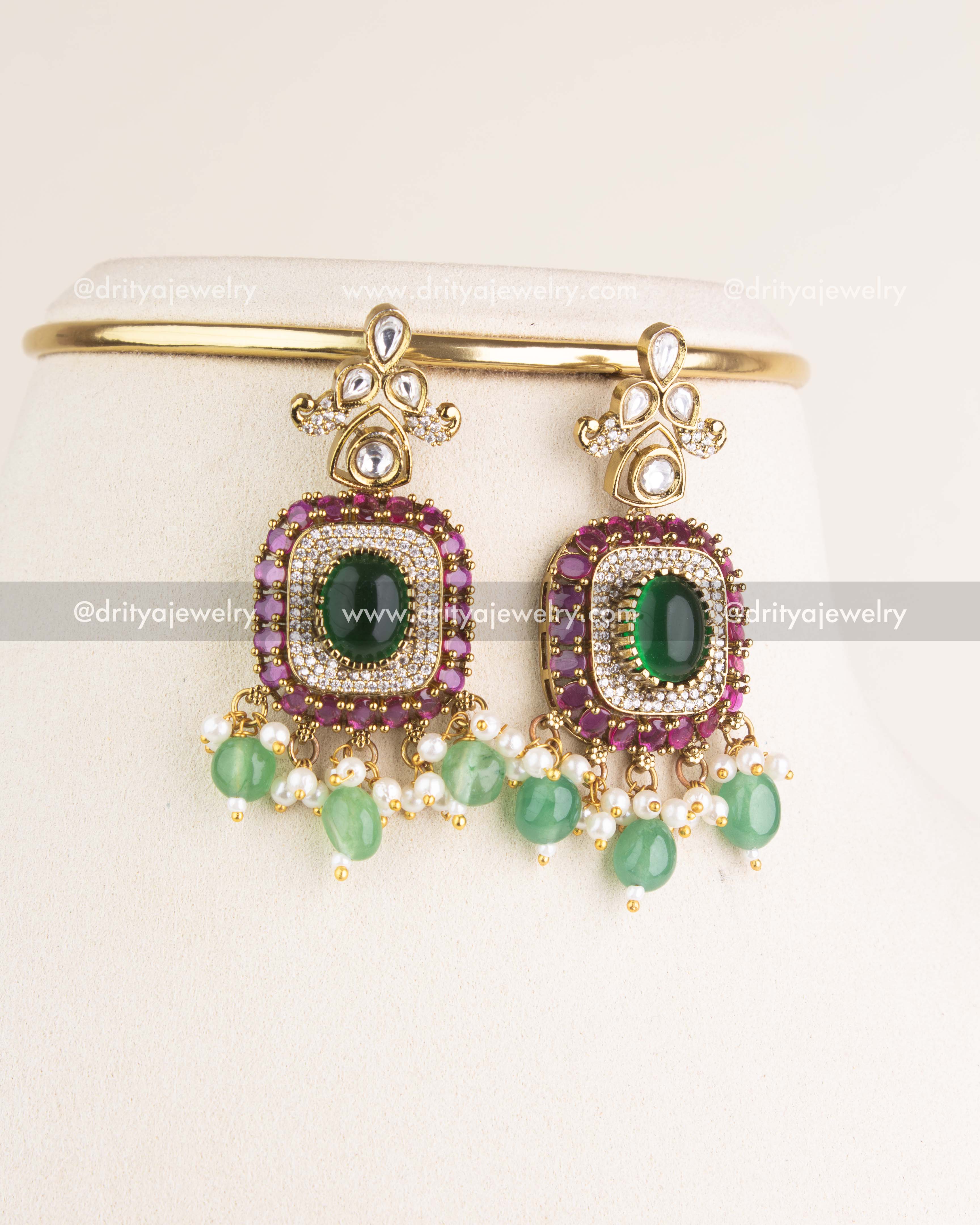 SKU 1144 Necklace Set close-up of matching kundan earrings with green stones and bead drops.