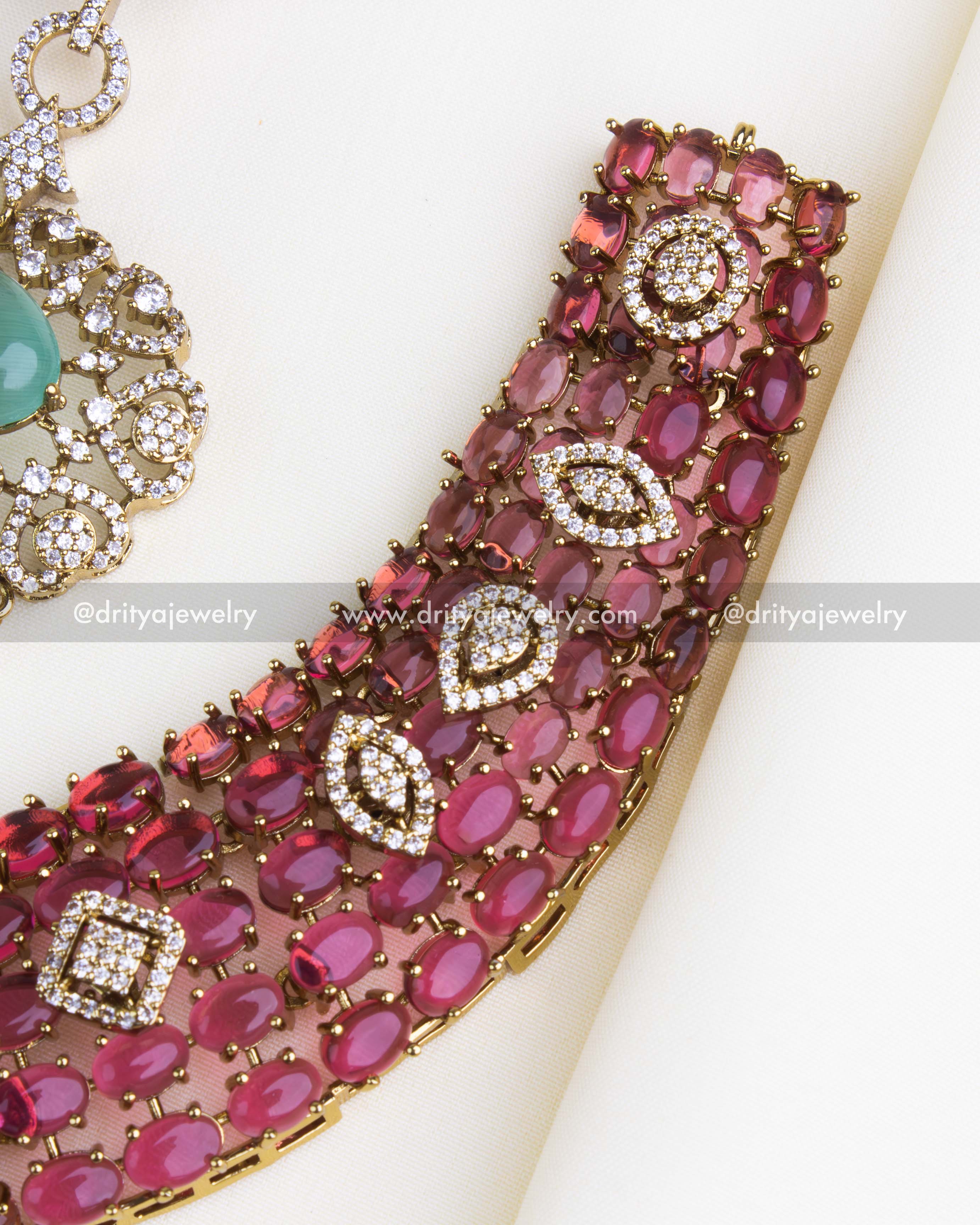 SKU 1110-PM - Necklace Set - Detail view of pink cushion-cut stone collar with kundan-style motifs