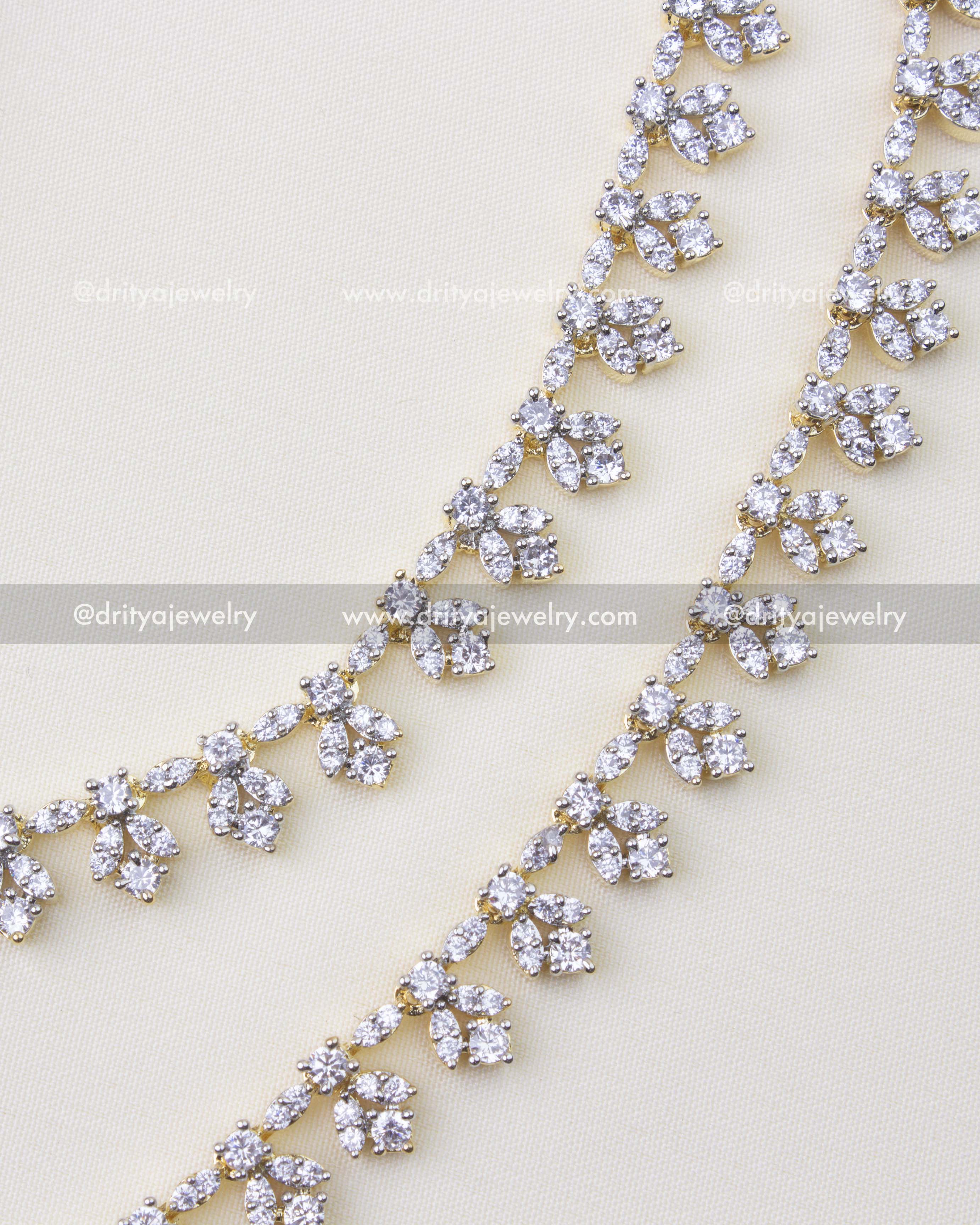 1233 - Close-up of premium CZ floral champaswaralu hair chain detailing