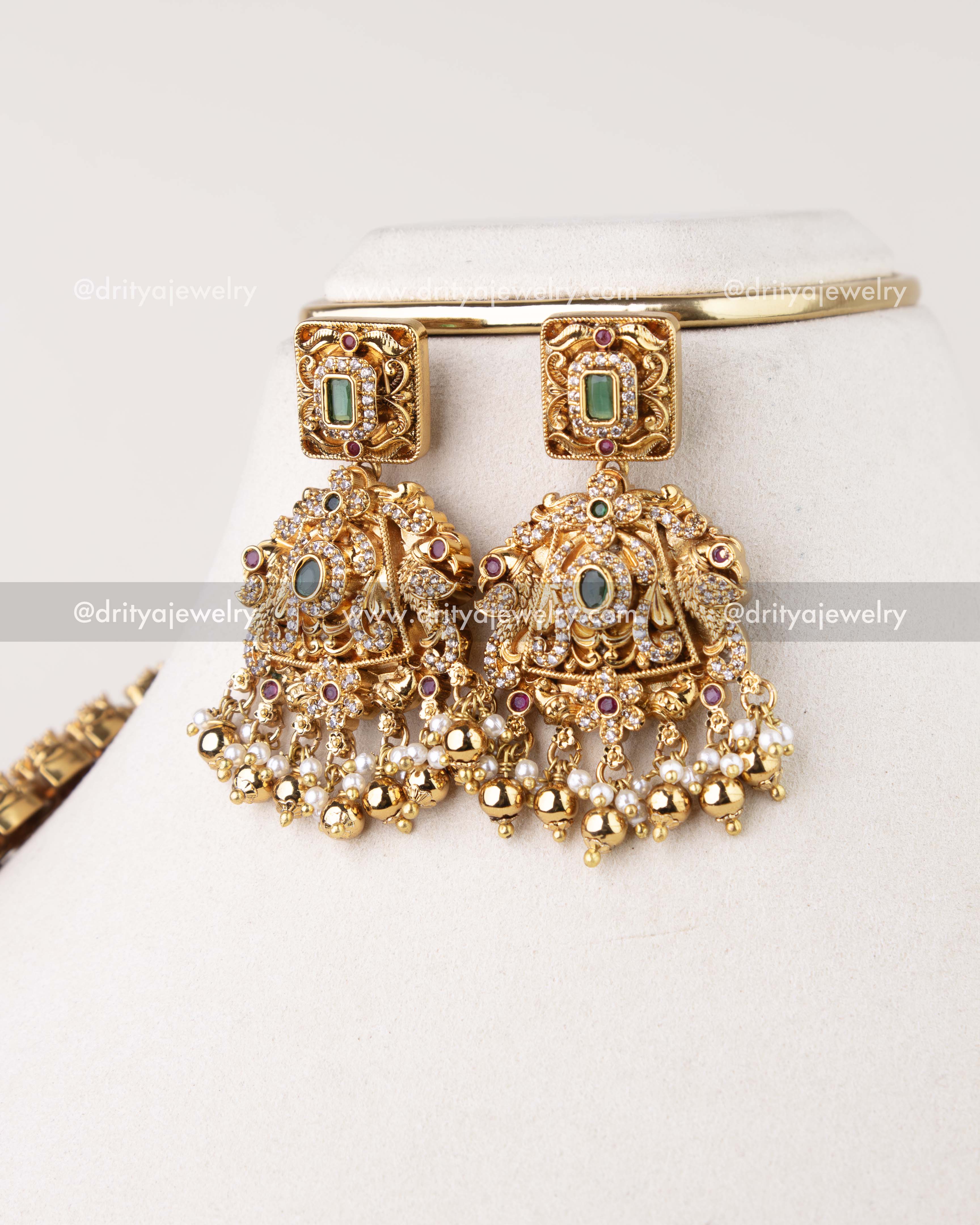 1310 - Close-up of antique gold bridal dangler earrings with pearl-like drops from long haram set
