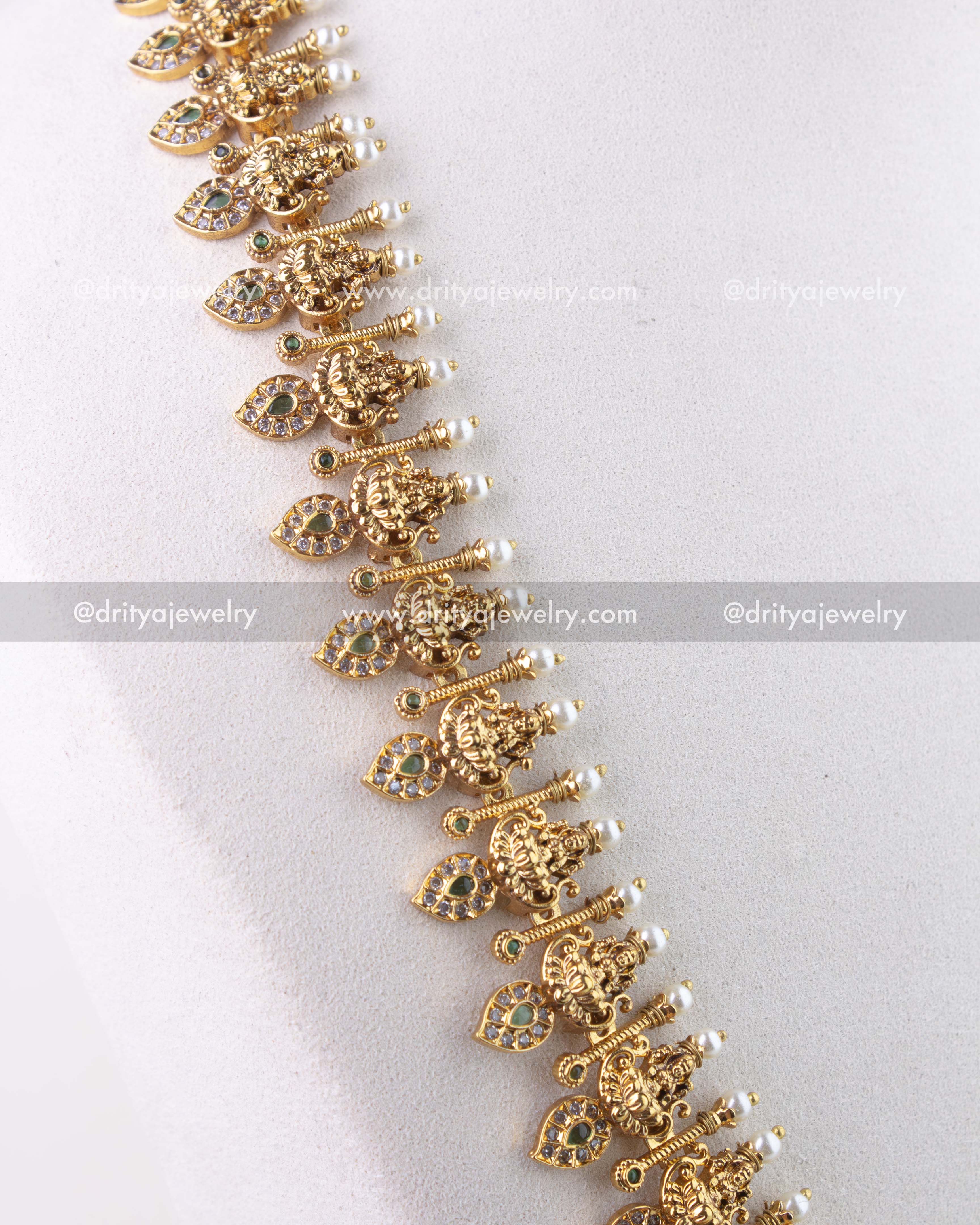 1279-G side angle showing intricate idol drops and stone-studded mango elements