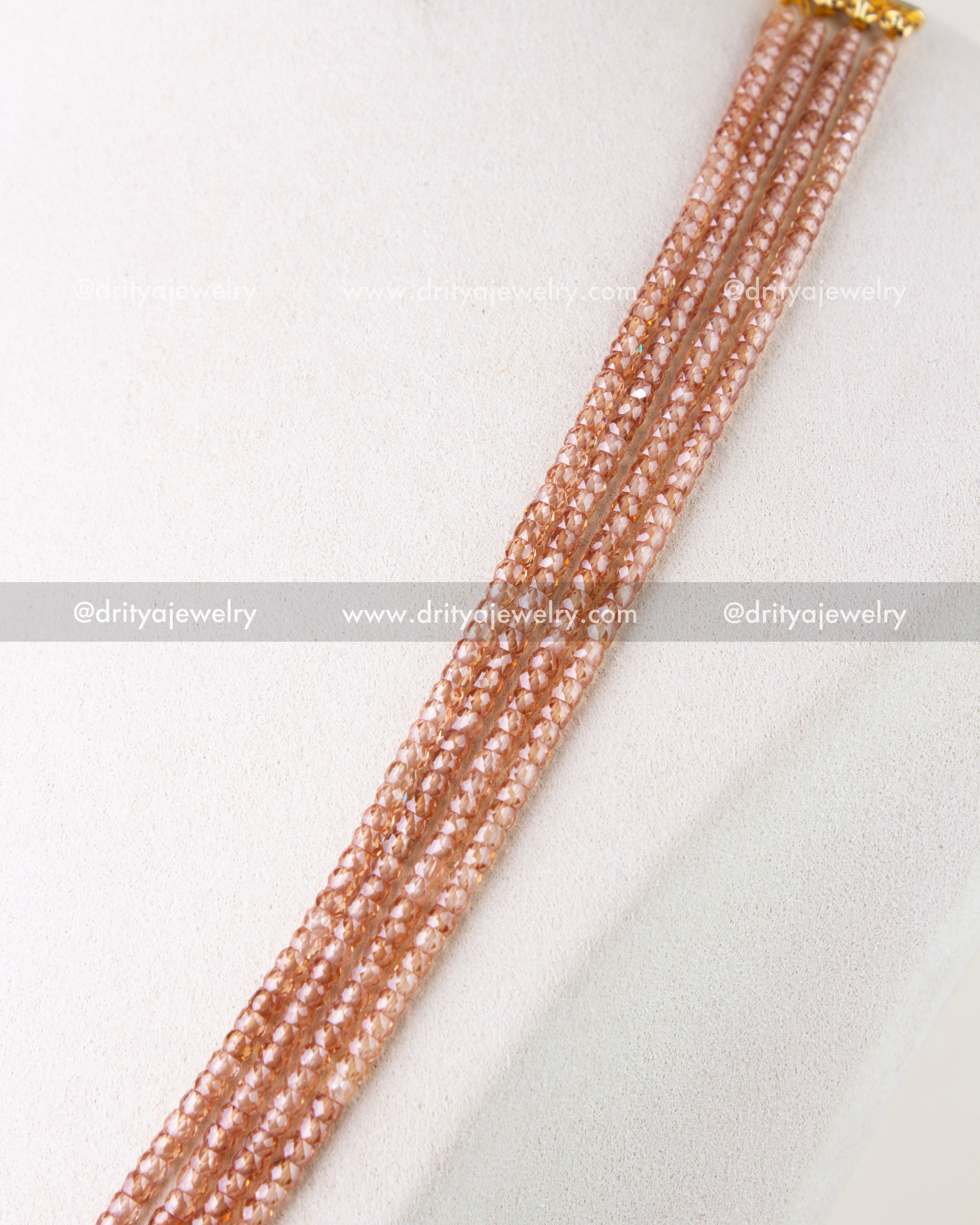 1281 - Side view highlighting multiple strands of blush-toned CZ beads on necklace