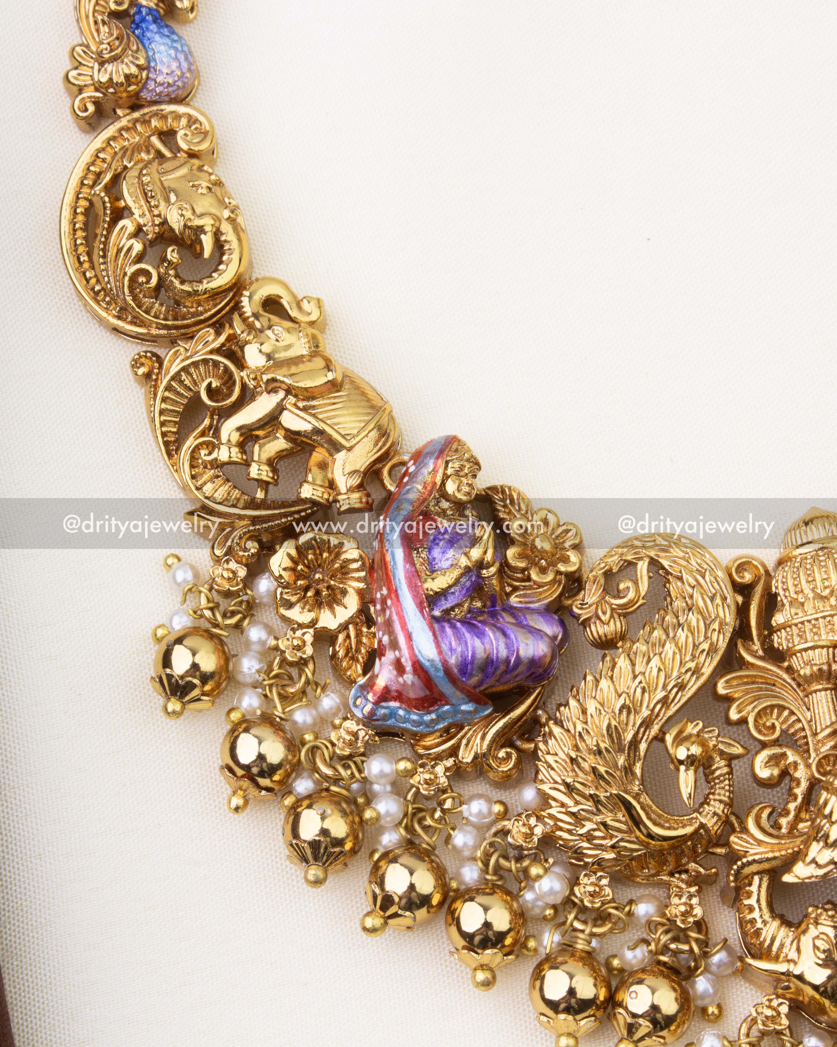 SKU 1262 - Close-up of side motifs on temple necklace with elephant and peacock detailing
