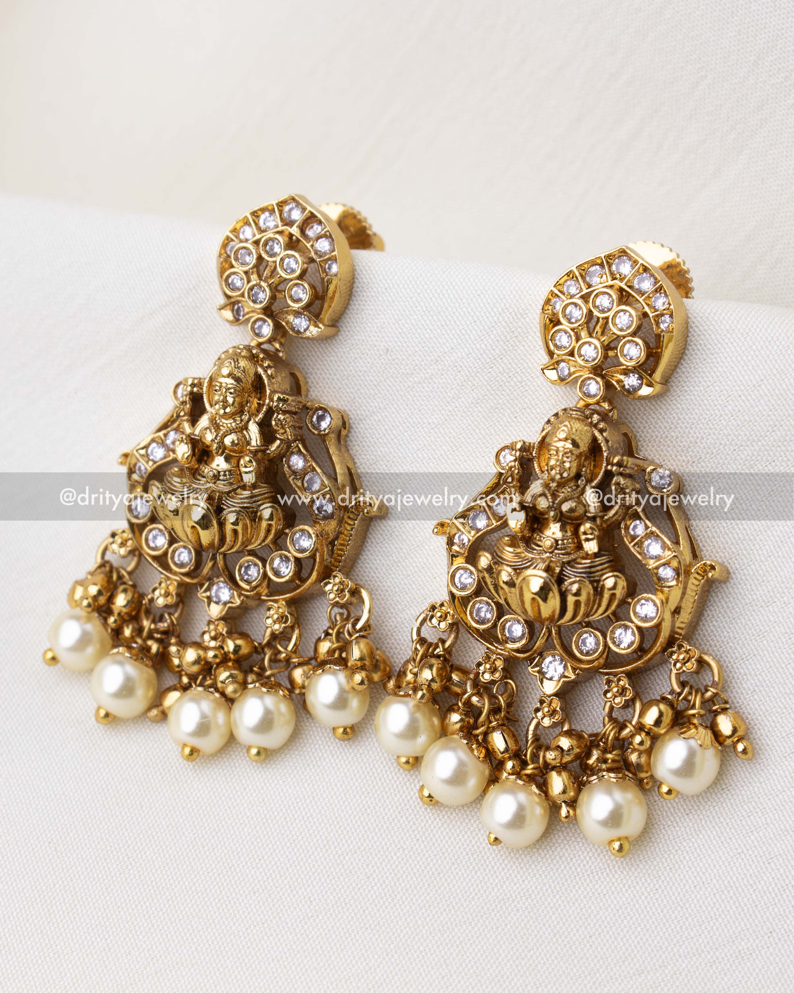 1266 - God idol pearl drop earrings close-up front view