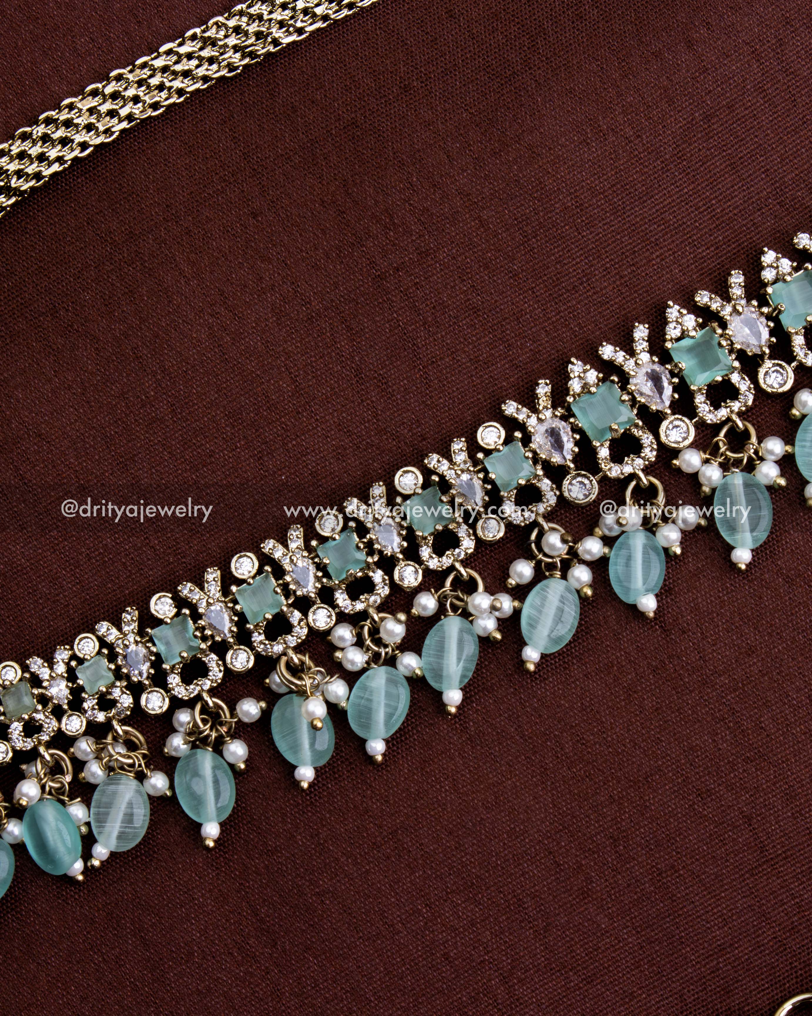 1130-MG hip chain detailed side view highlighting layered mint stone drops and pearl accents