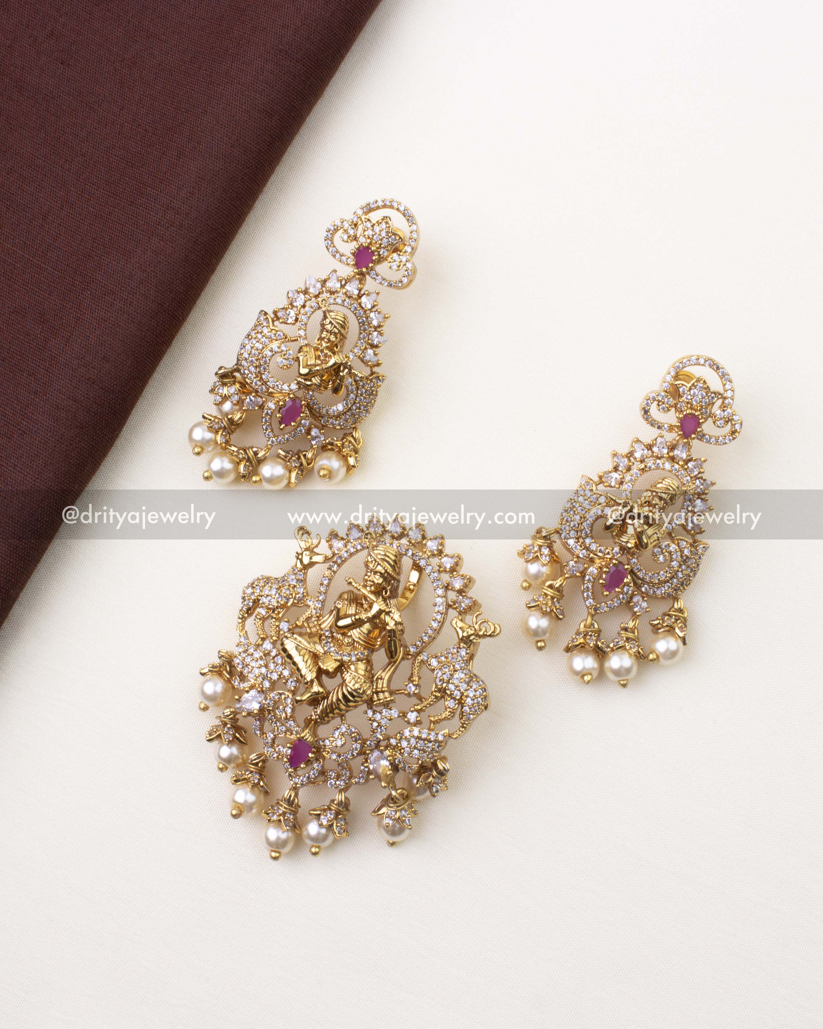 1239 complete Lord Krishna pendant and earrings set laid out