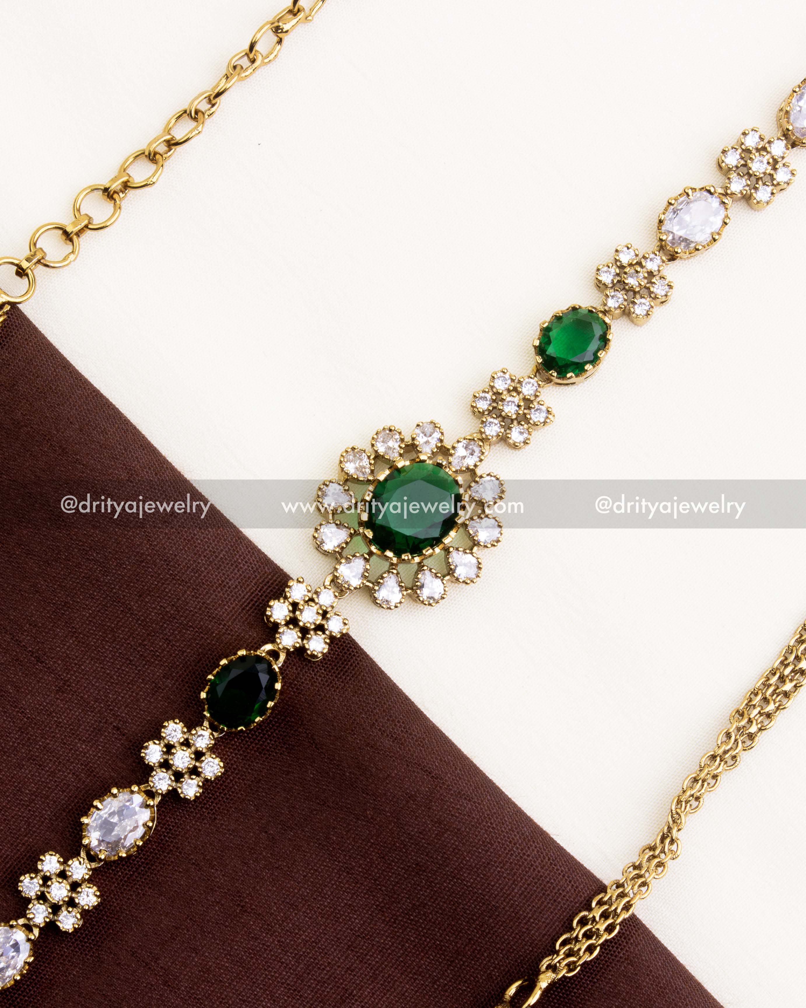 1109-G close-up of floral CZ and emerald centre motif on Victorian hip chain