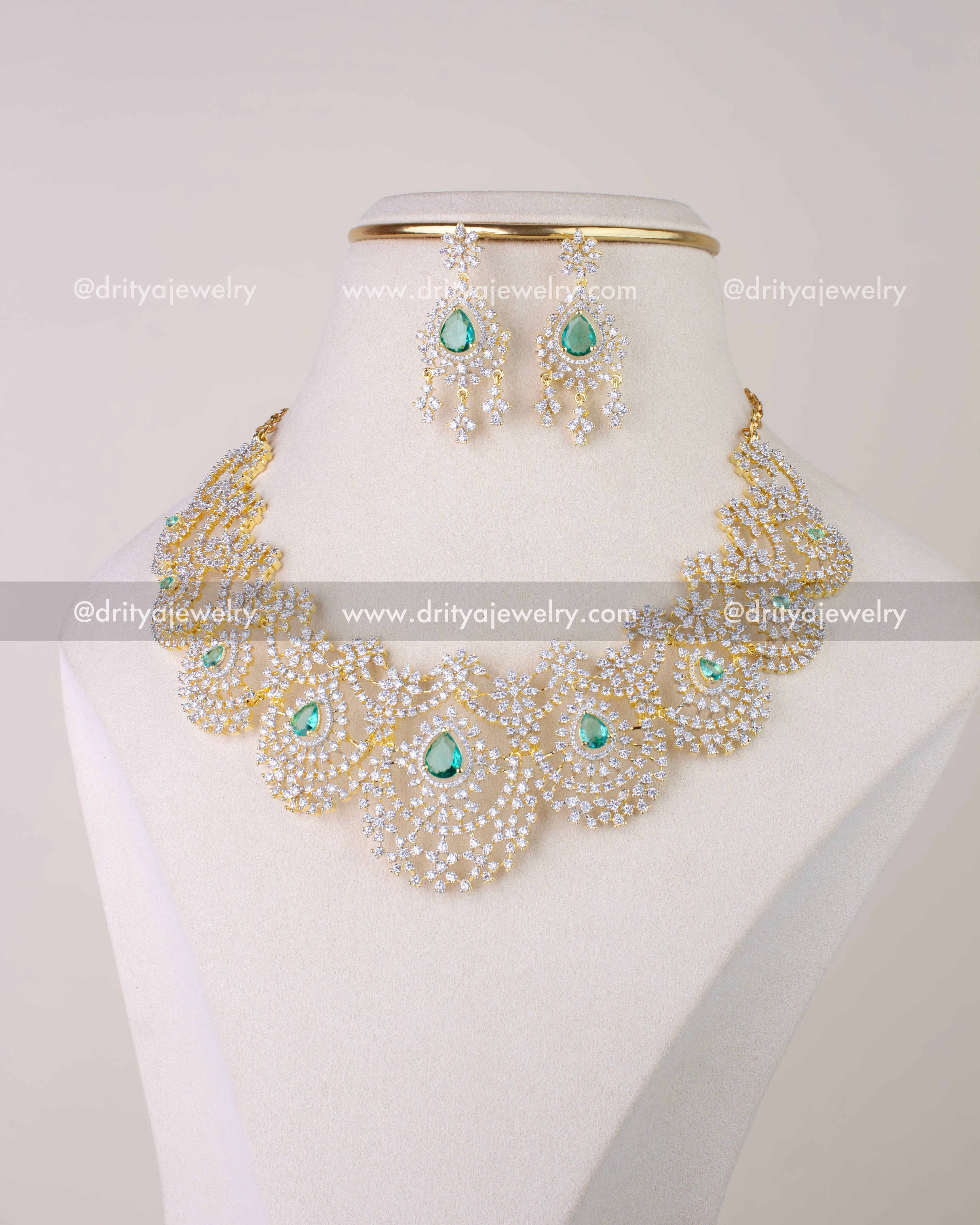 1278-RE emerald CZ necklace set with matching dangler earrings on display bust