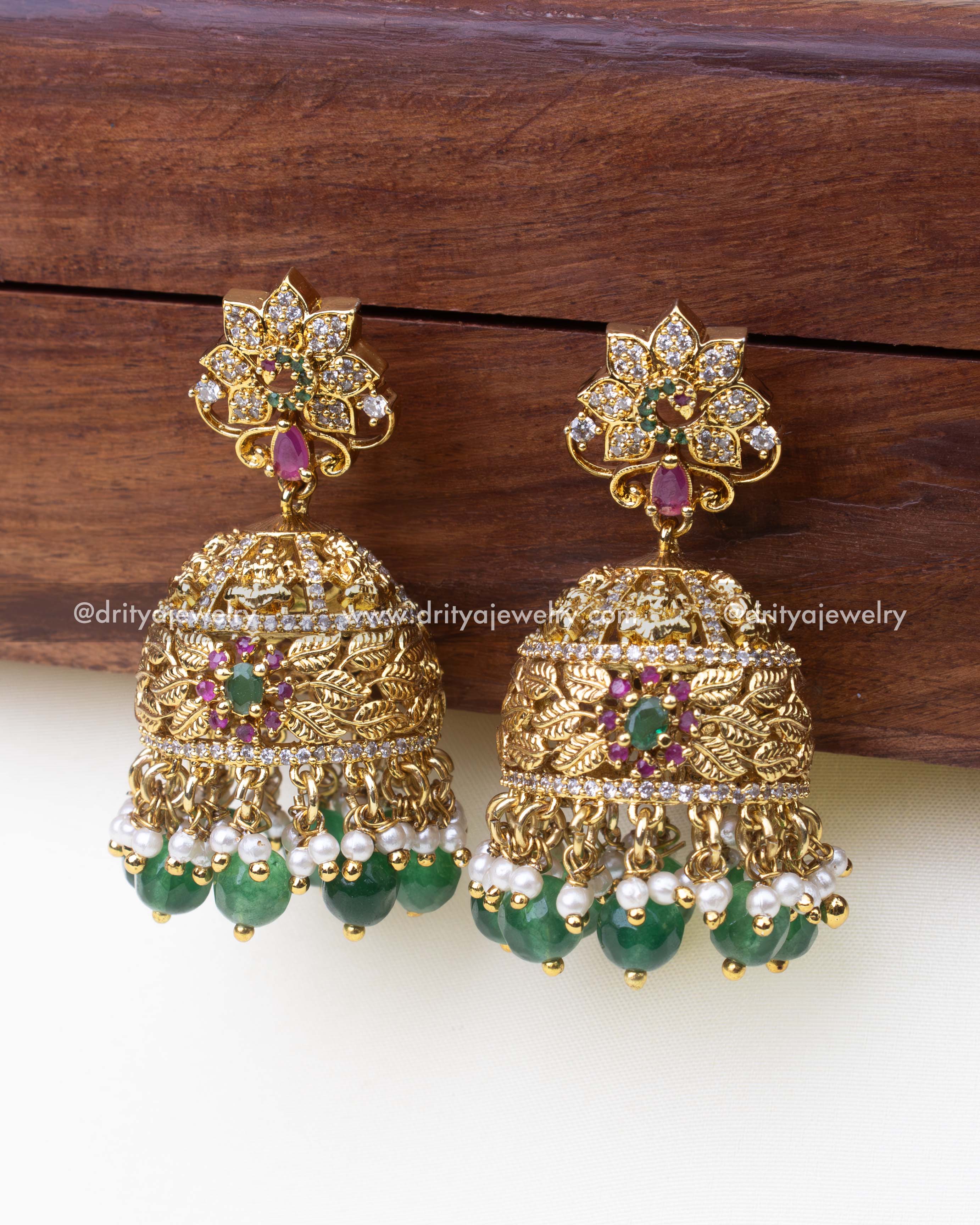 1241-G big size temple jhumka earrings front view showing leaf design and green bead drops