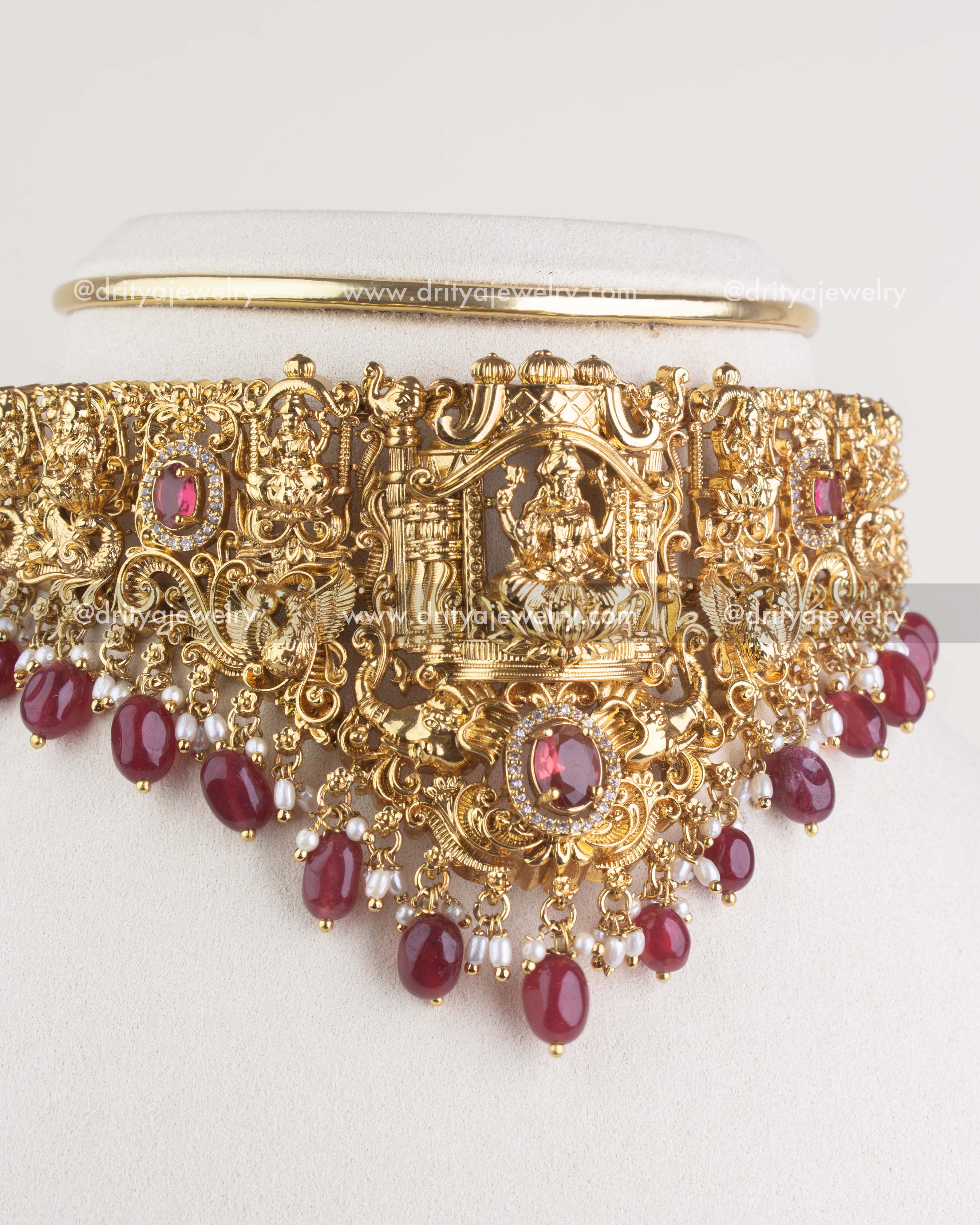 Front close-up of temple choker necklace with central goddess idol and ruby red bead fringe
