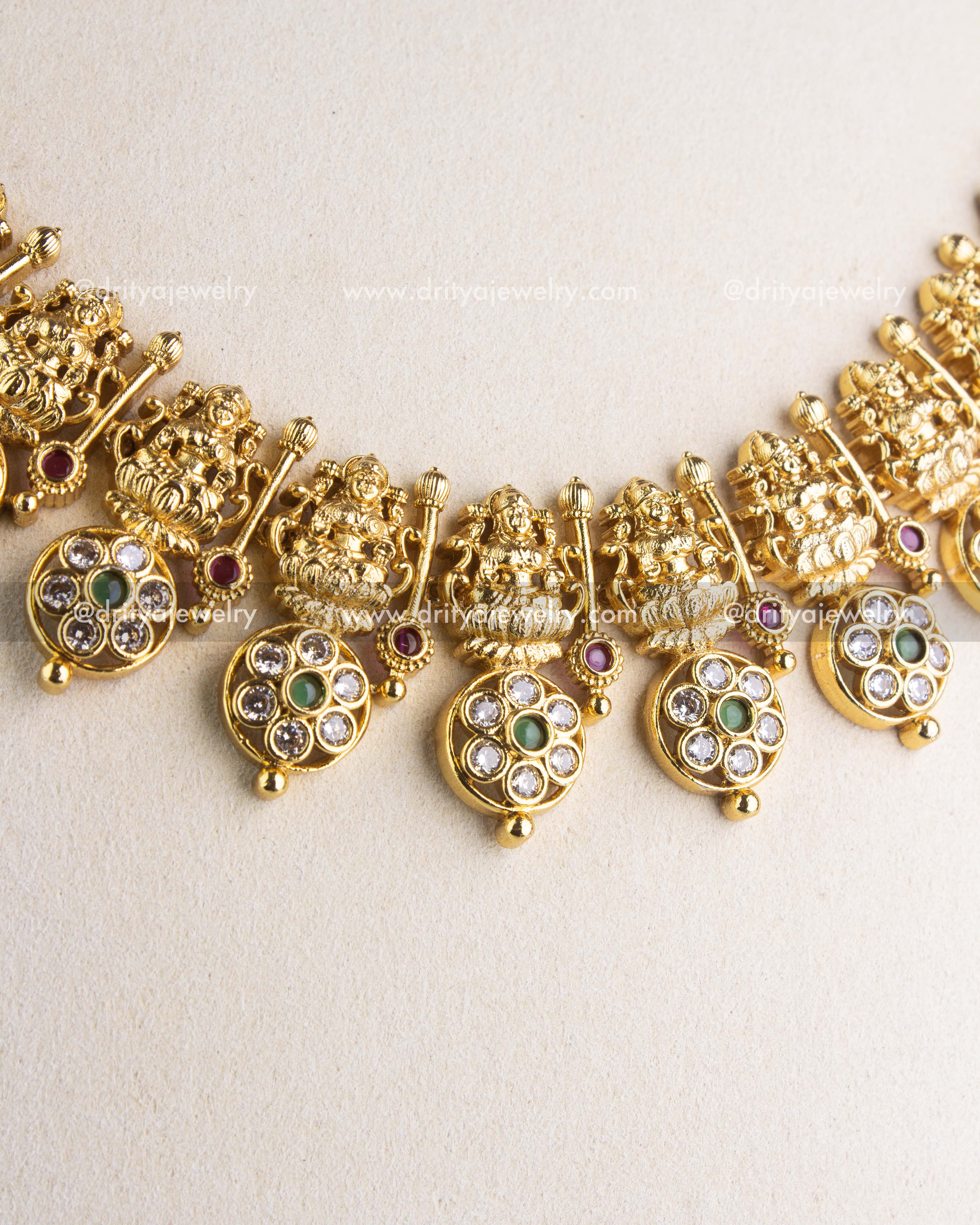 SKU 1145 Necklace Set close-up of god idol motifs and circular CZ stone-studded drops