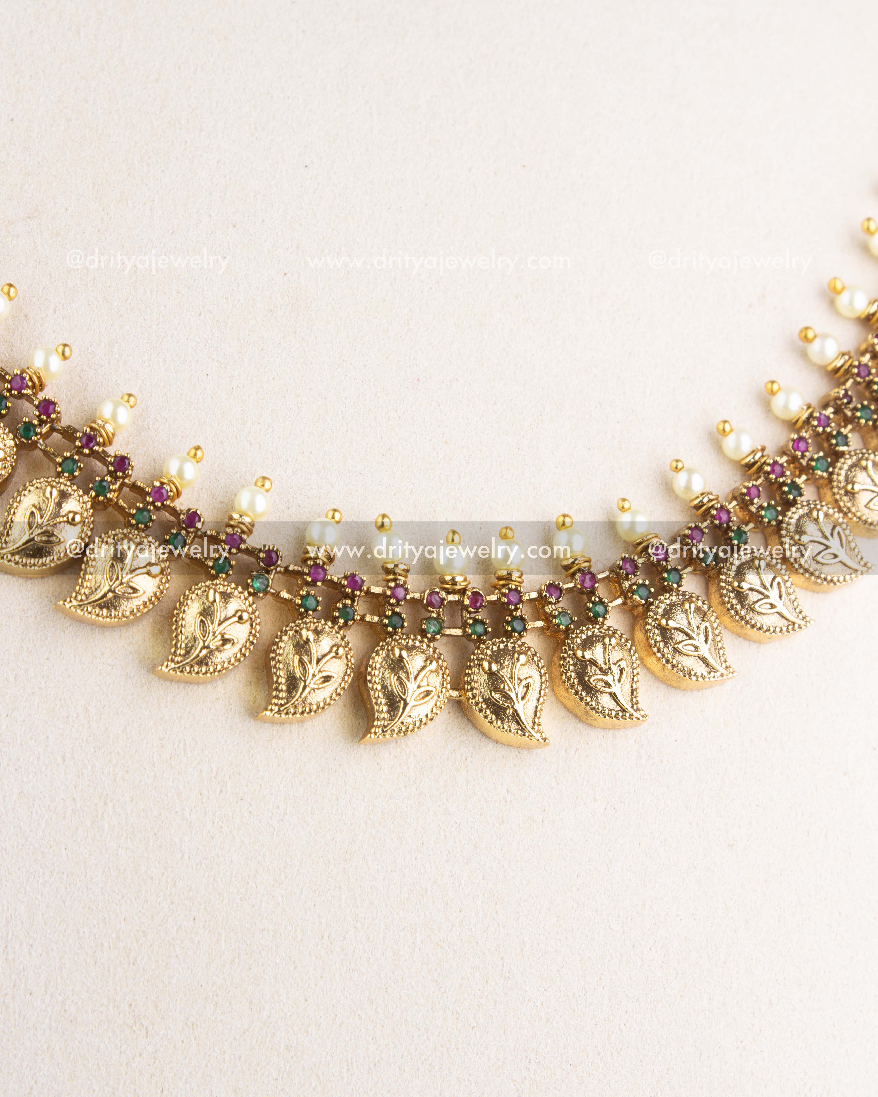 Side detail view of paisley motif stone-studded necklace with pearl-like drops, SKU 1132