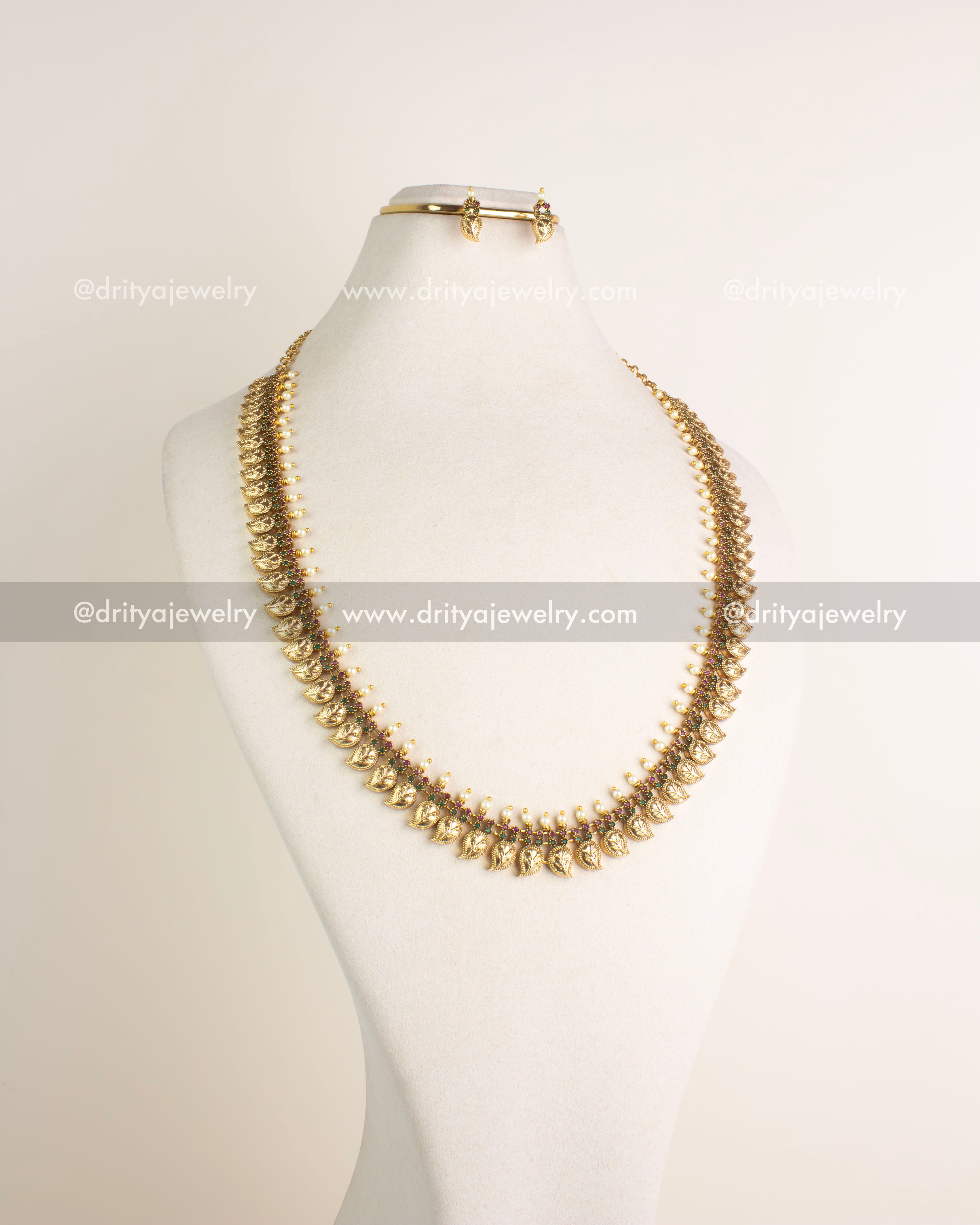 Full display of paisley motif necklace set on bust showing matching earrings, SKU 1132