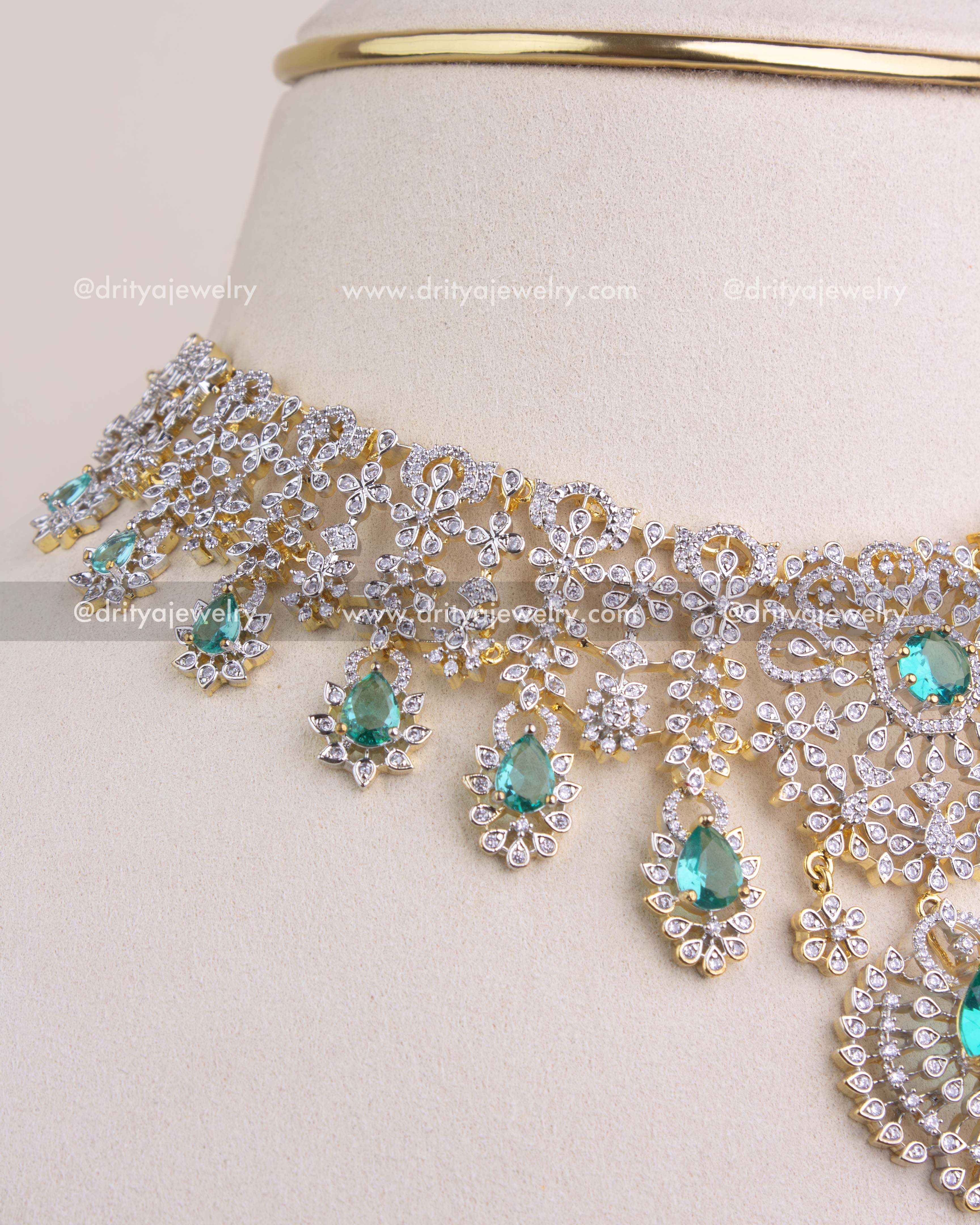 1227 - Side view showing cascading emerald drops on necklace