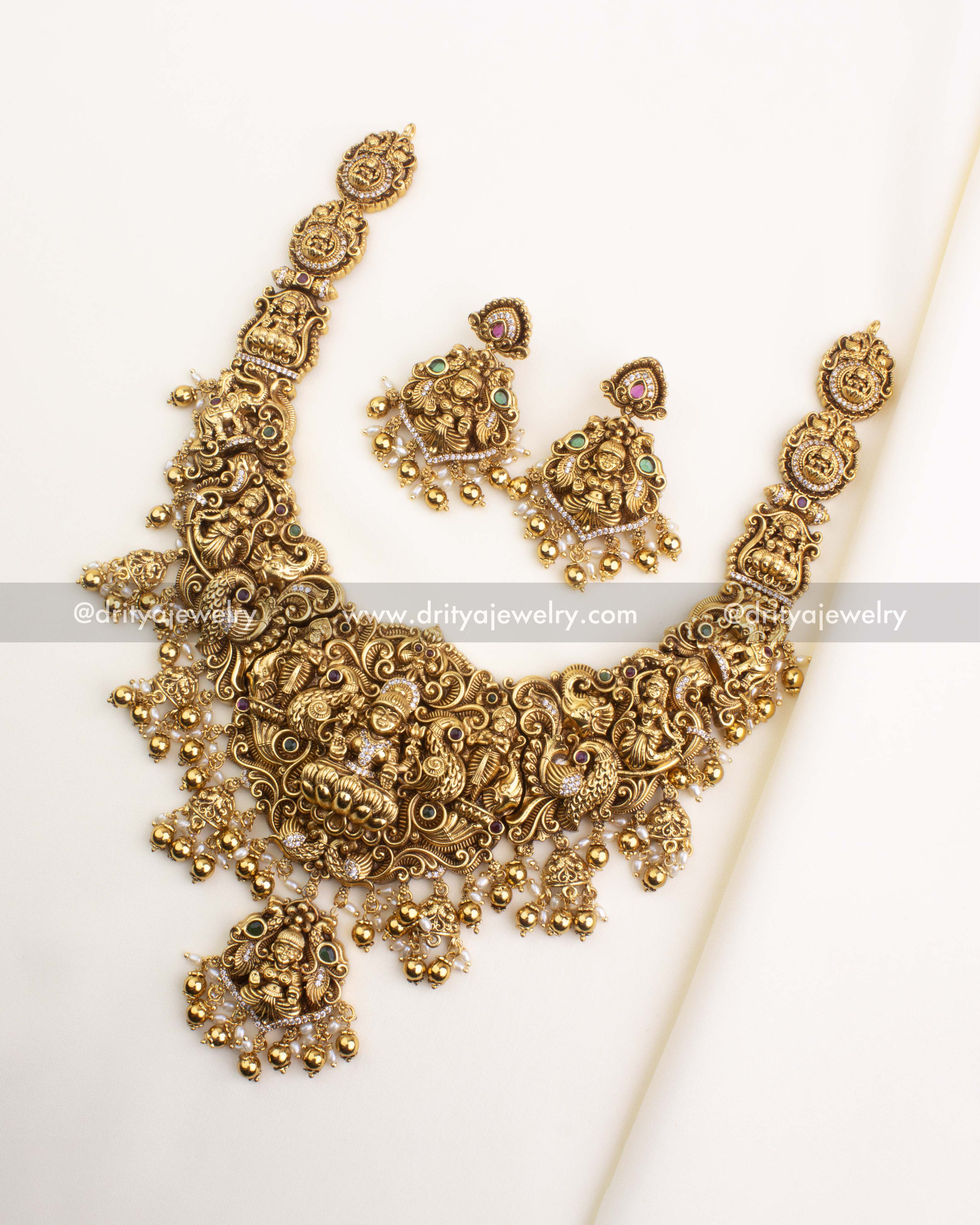 SKU 1167 full temple necklace set with matching earrings laid flat