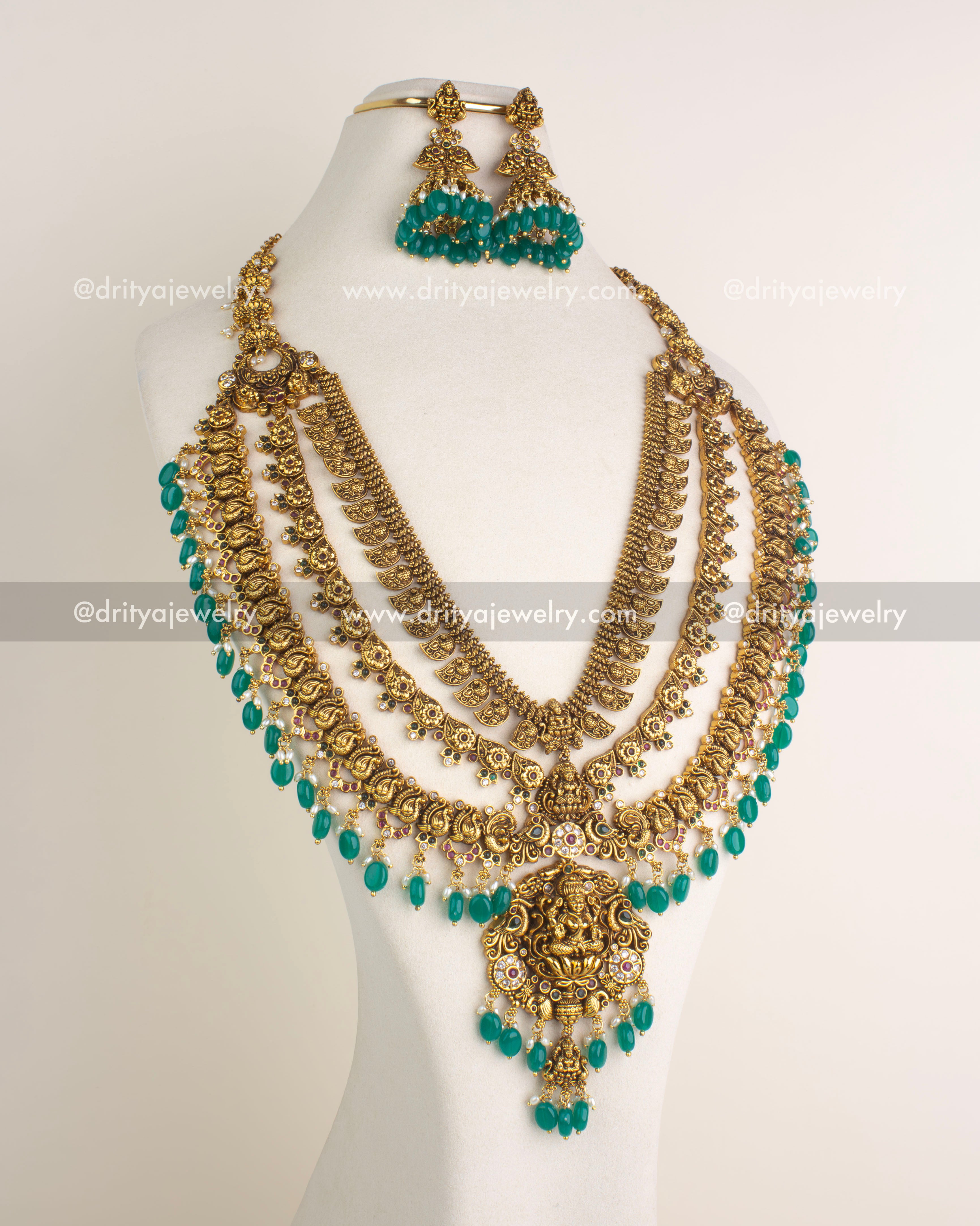 SKU 1164 Necklace Set front view showing multi-layer gold-toned temple necklace with green bead drops and matching earrings.