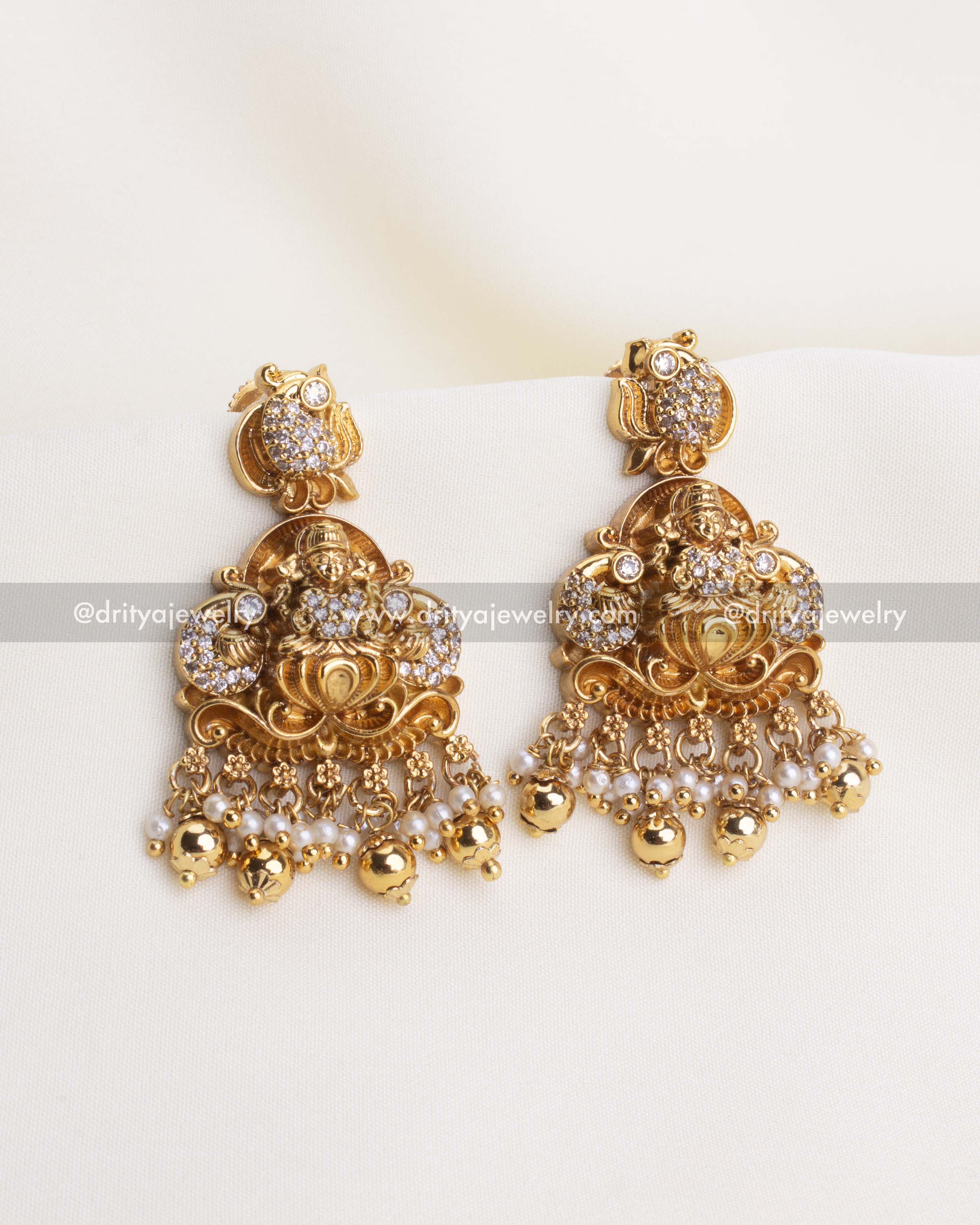 700-W - Necklace Set - Close-up front view of god idol earrings with CZ stones and pearl bead drops