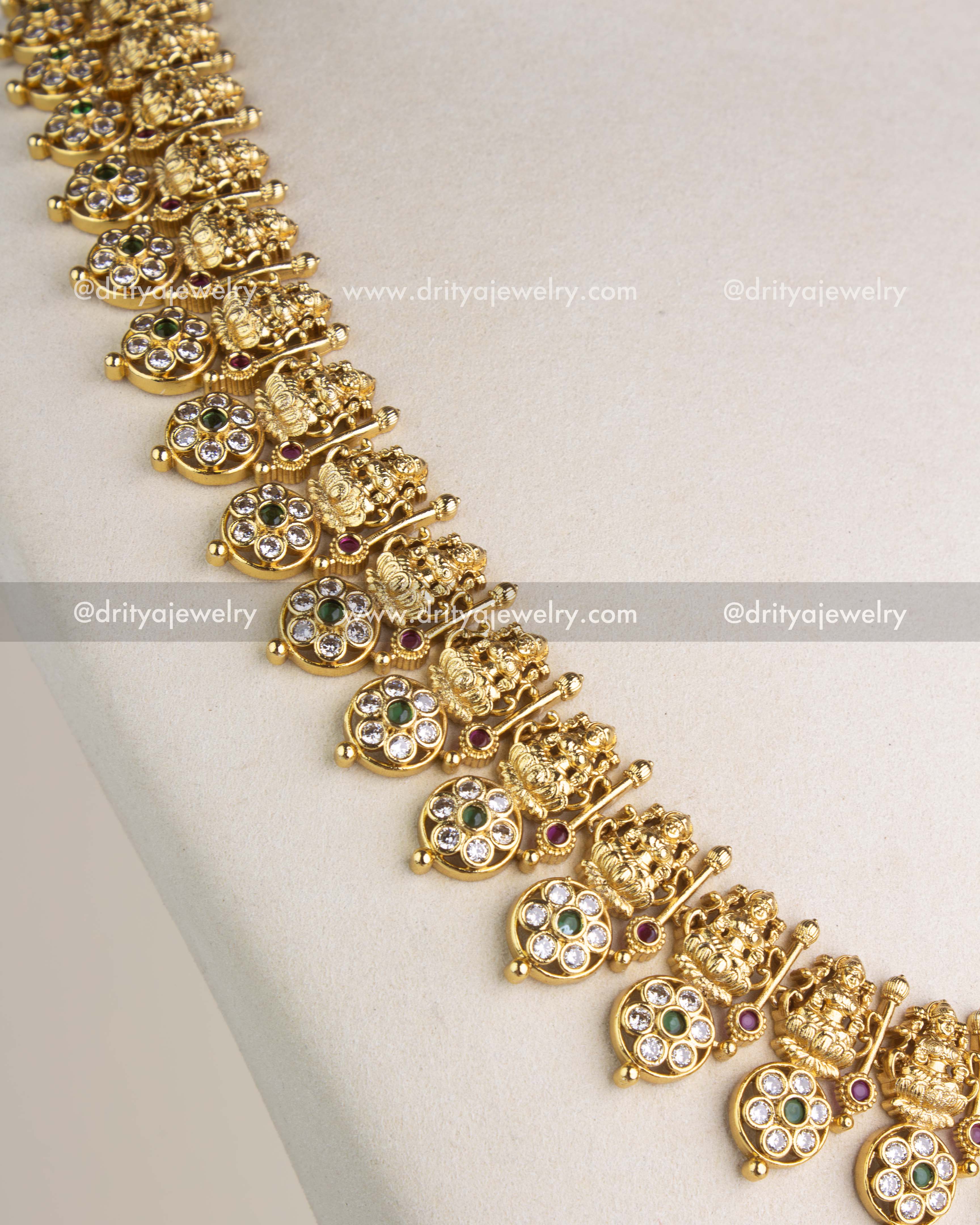 SKU 1145 Necklace Set angled detail of temple necklace links with deity motifs and stone drops