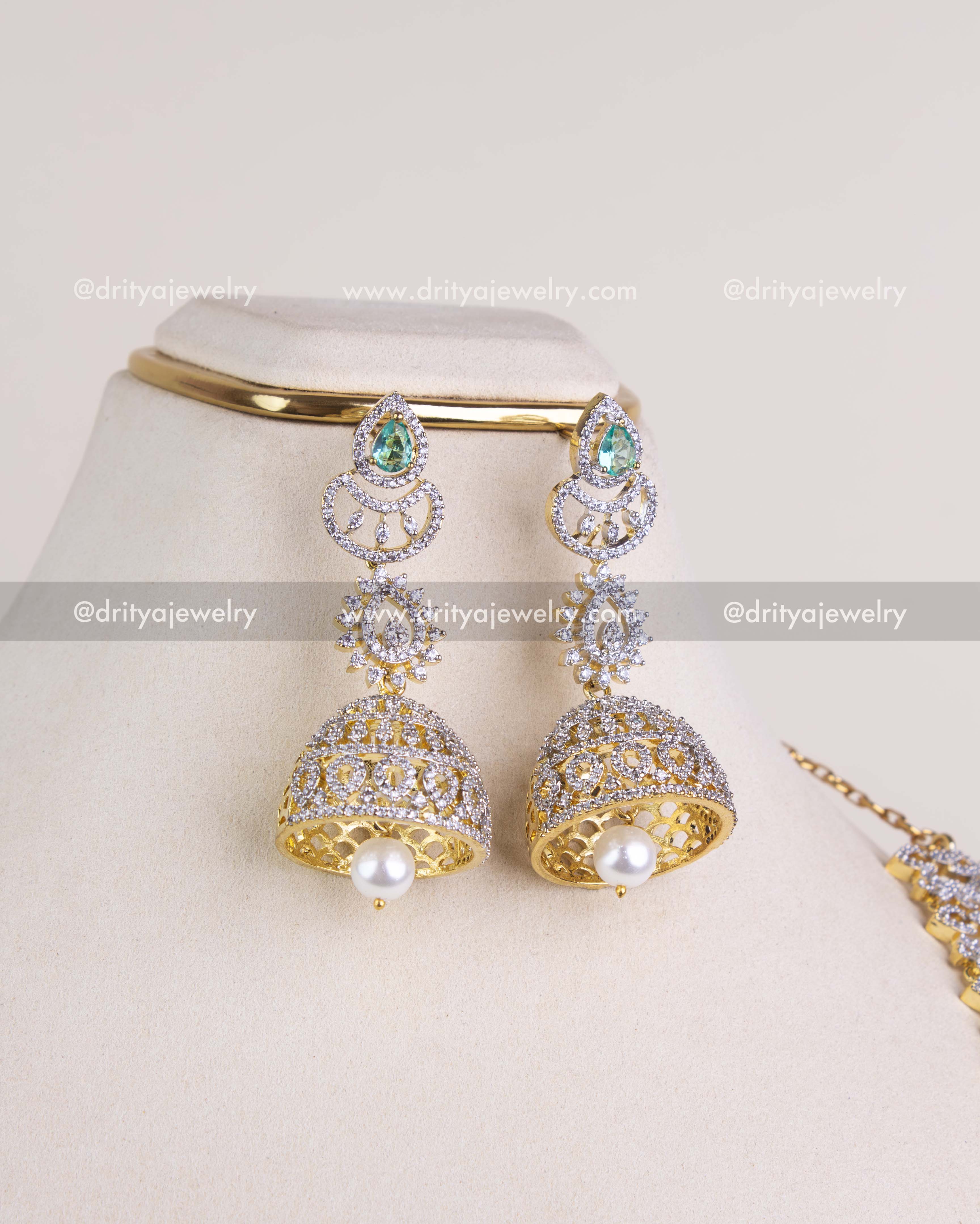 1208-RE big CZ jhumka earrings with emerald tops and single pearl drop