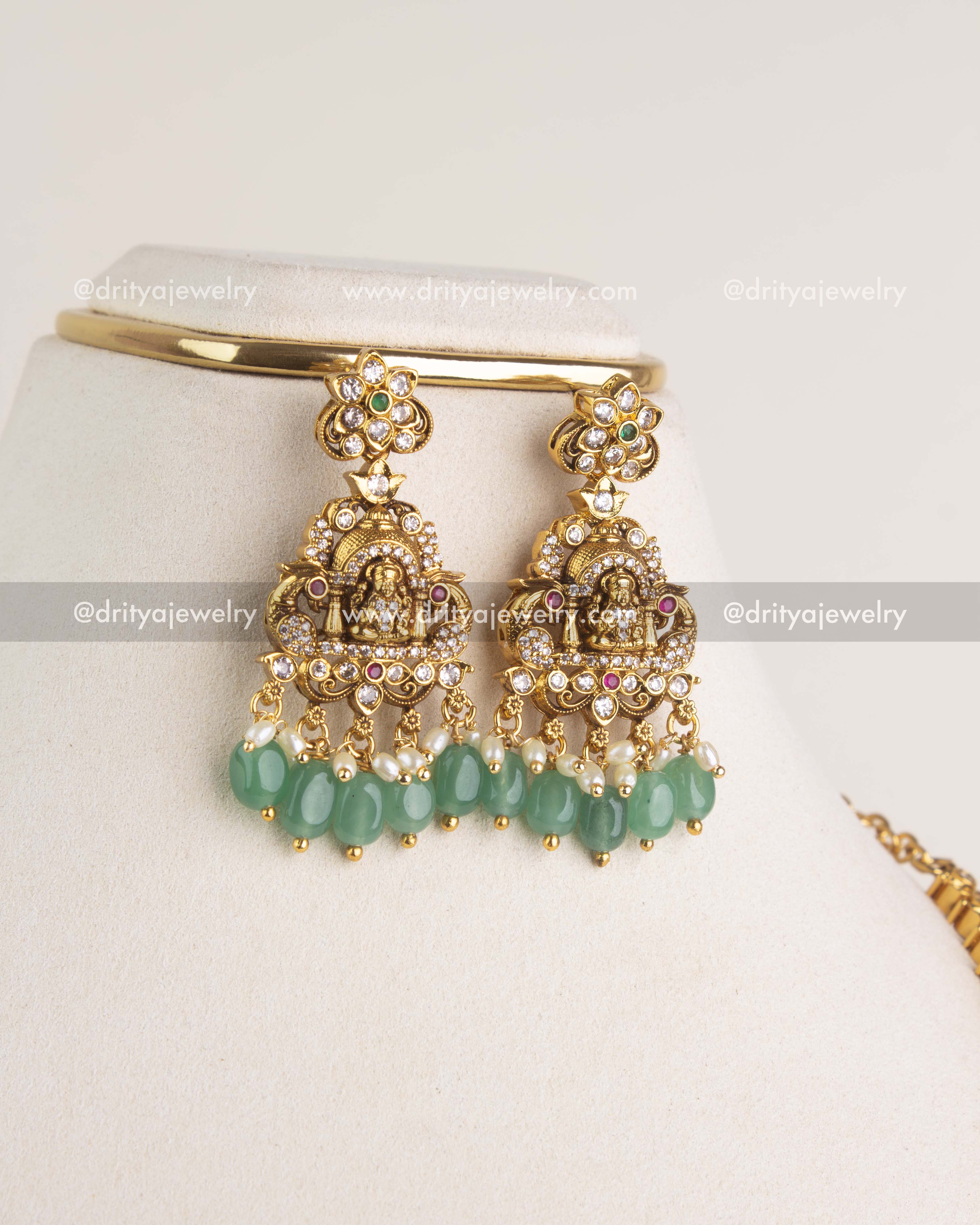 SKU 1169 matching god idol earrings with mint bead drops displayed on stand