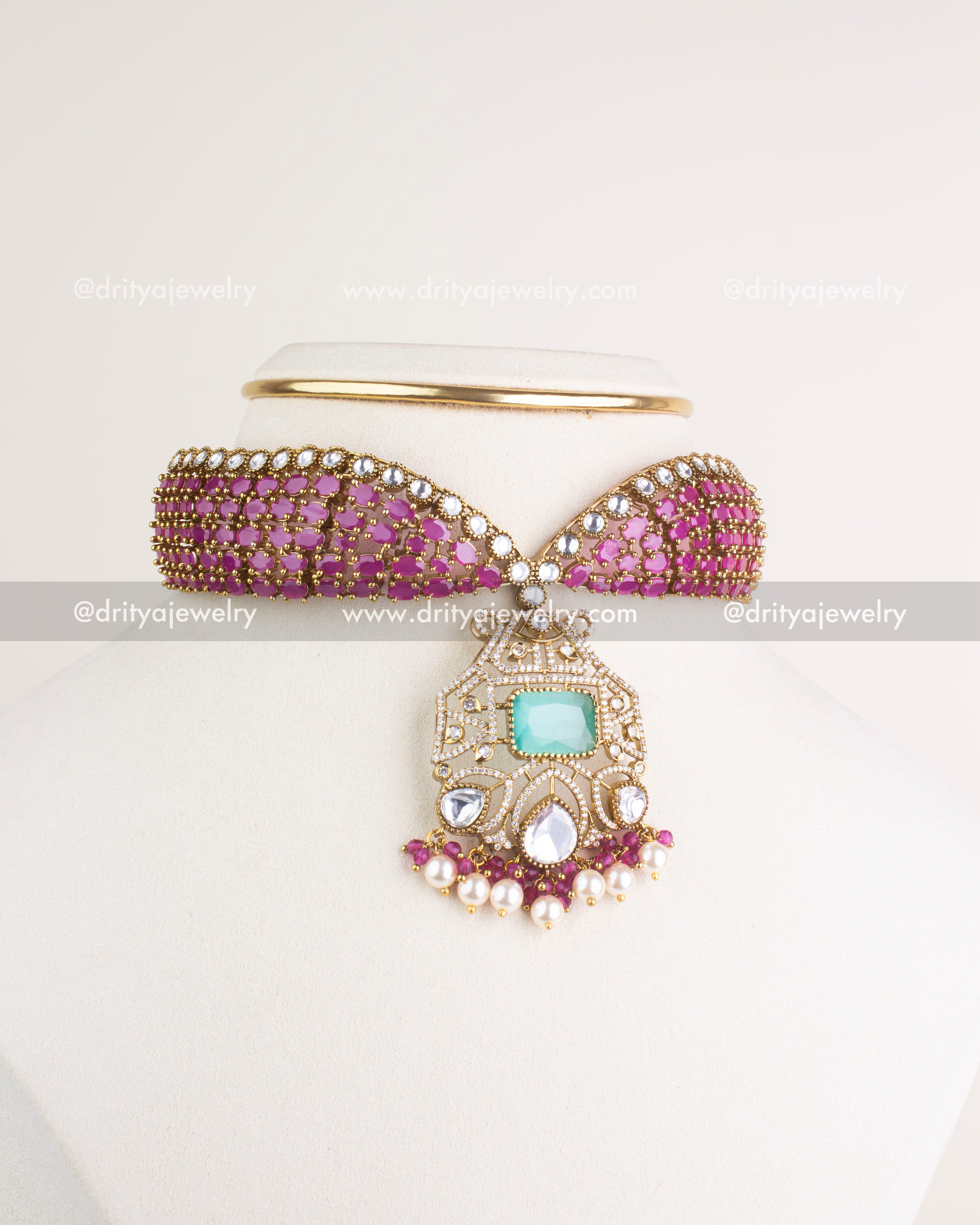 SKU 1205 Necklace Set full front view of pink kundan choker with ornate pendant on display stand.