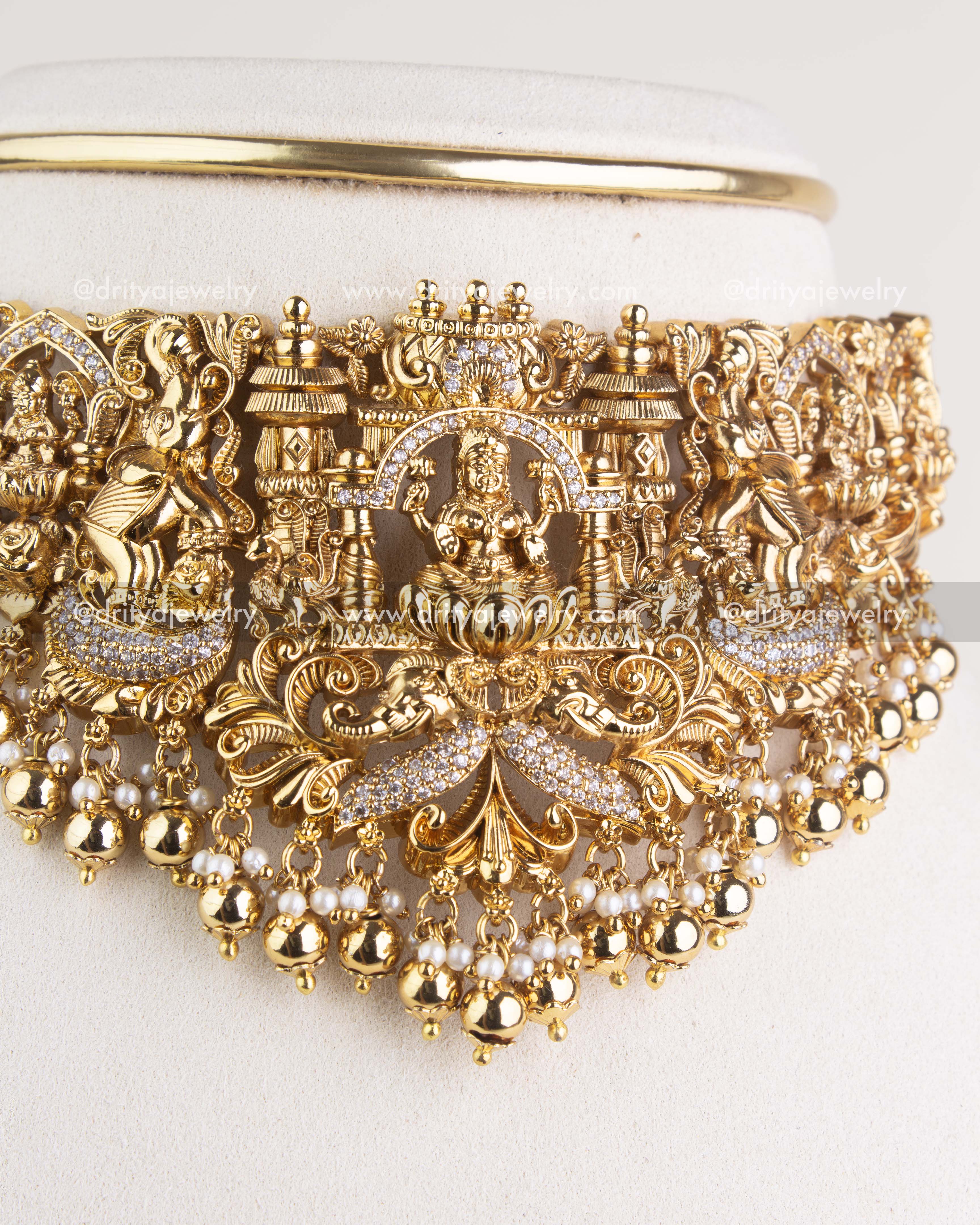 SKU 1128 Necklace Set angled view highlighting central deity motif and nakshi work