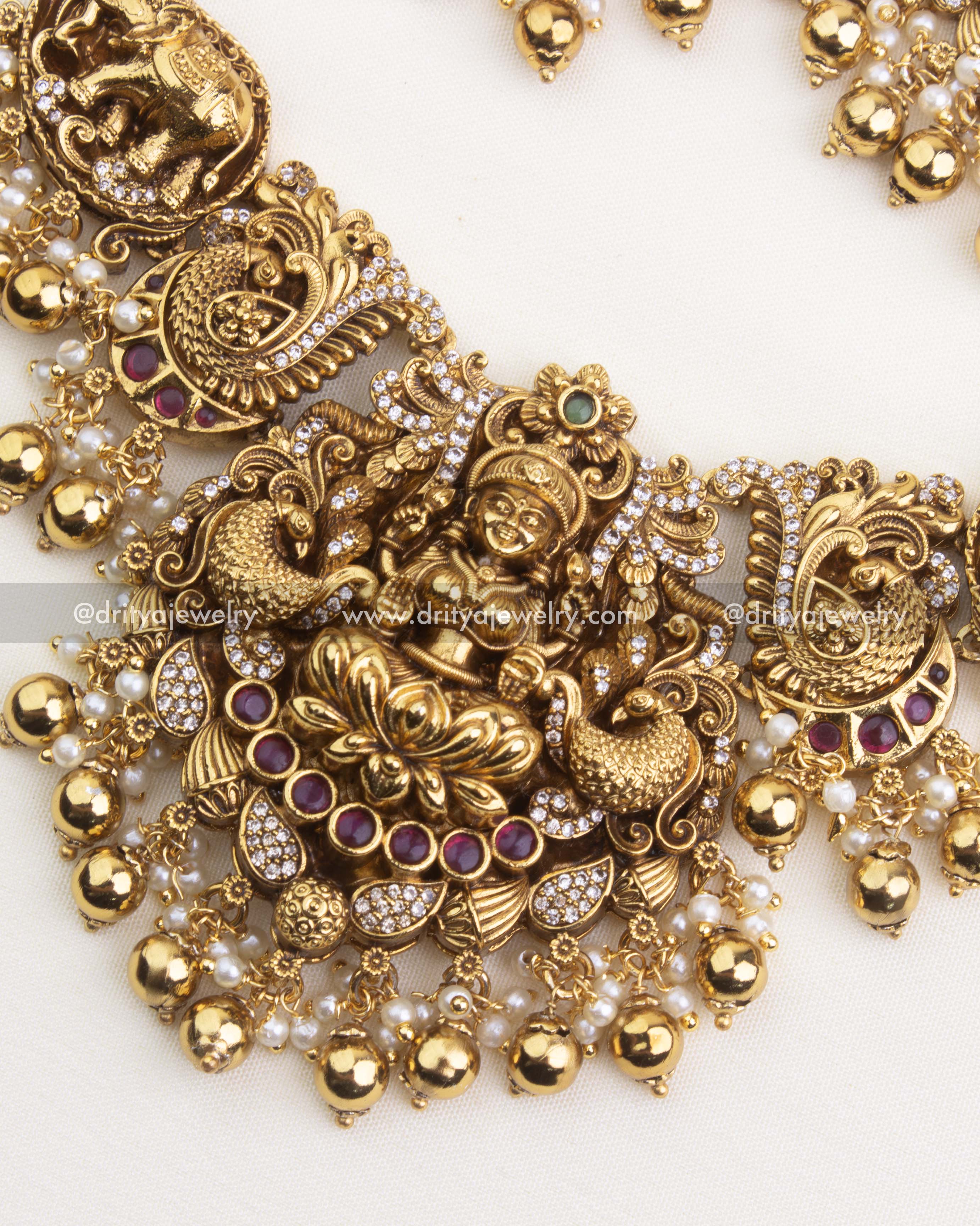 SKU 1250 close-up of central god idol pendant with ruby accents and pearl fringe