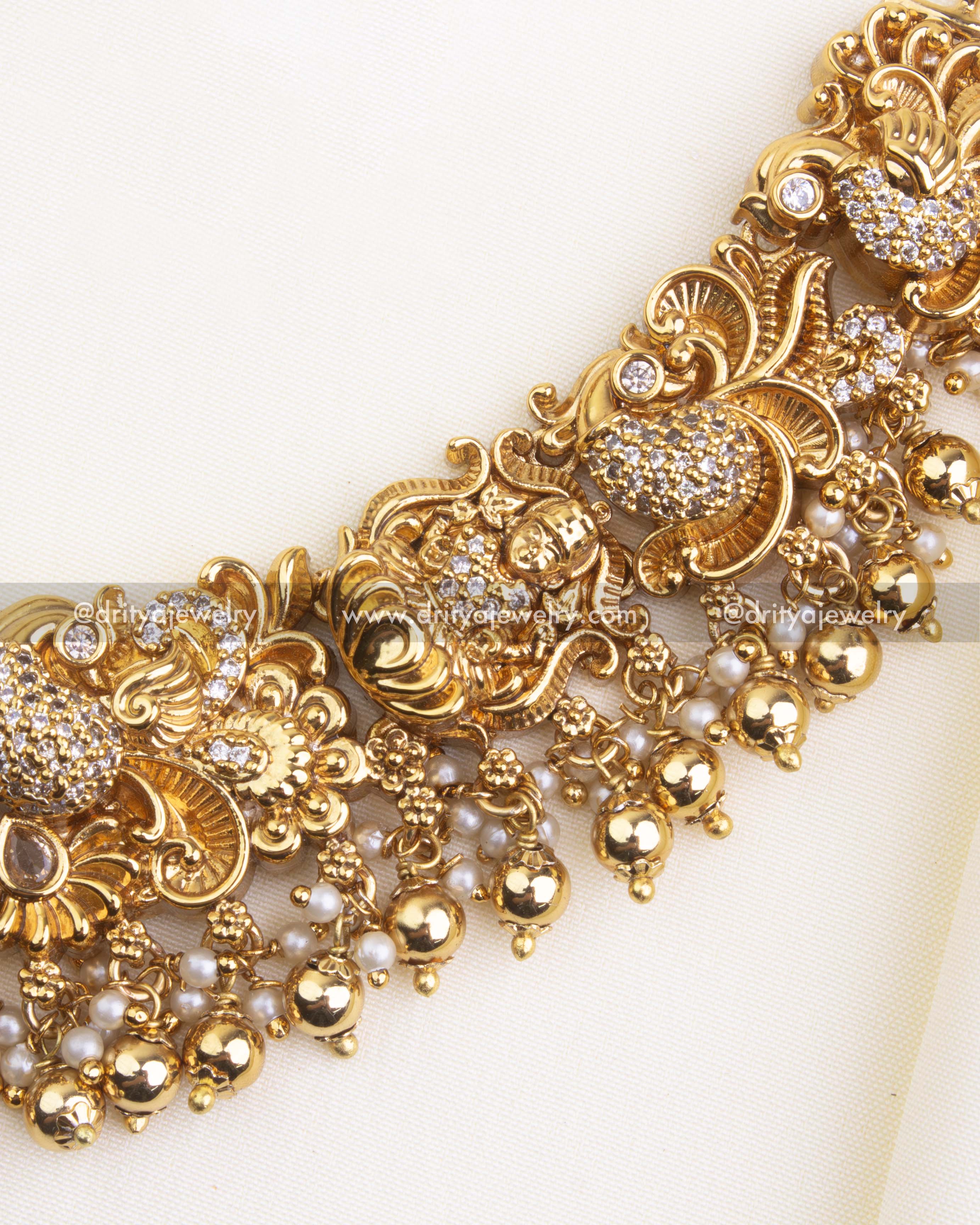 700-W - Necklace Set - Side section of short necklace showing god idol and floral CZ motifs with fringe