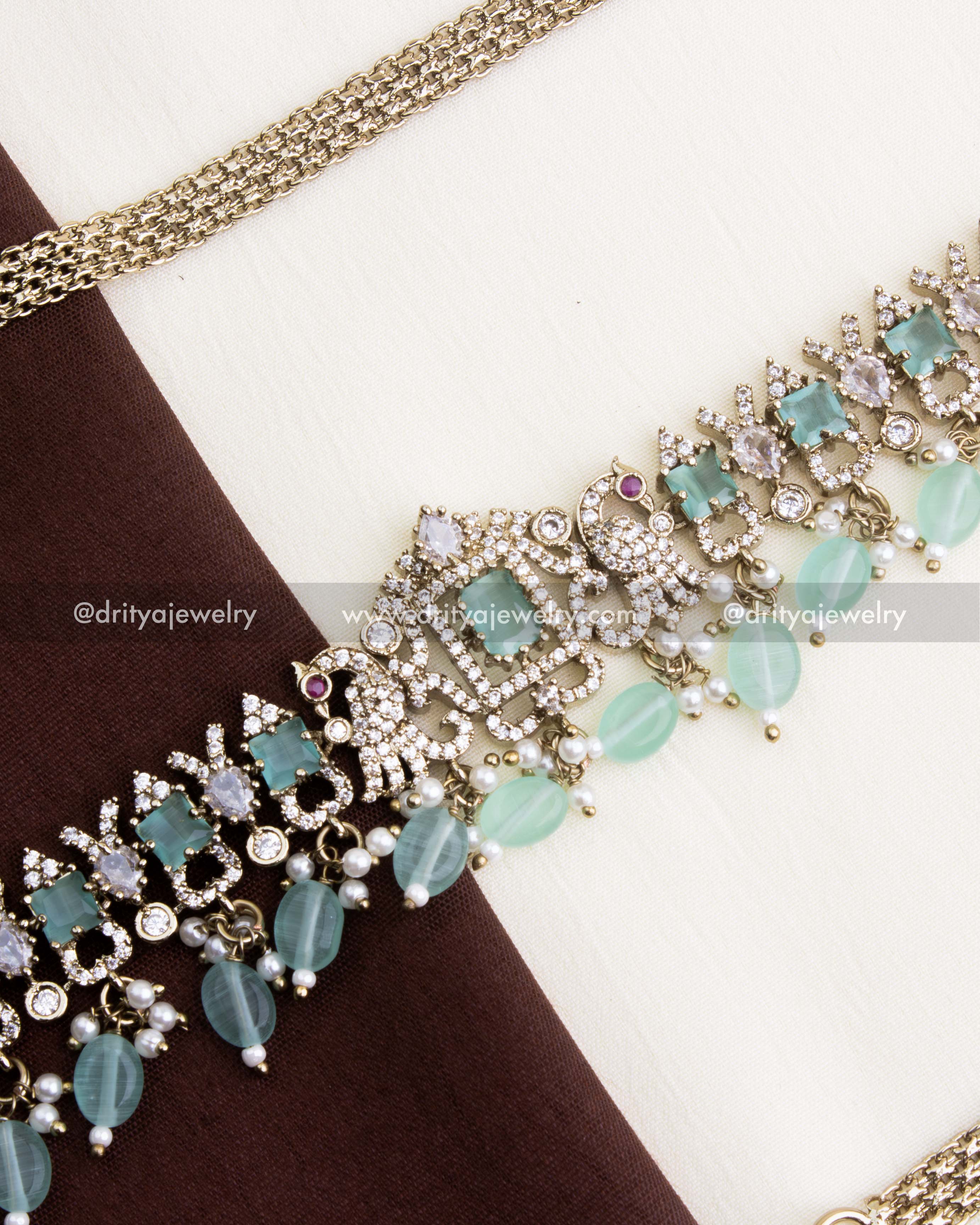 1130-MG hip chain close-up of Victorian motifs with mint stones, CZ clusters and bead drops
