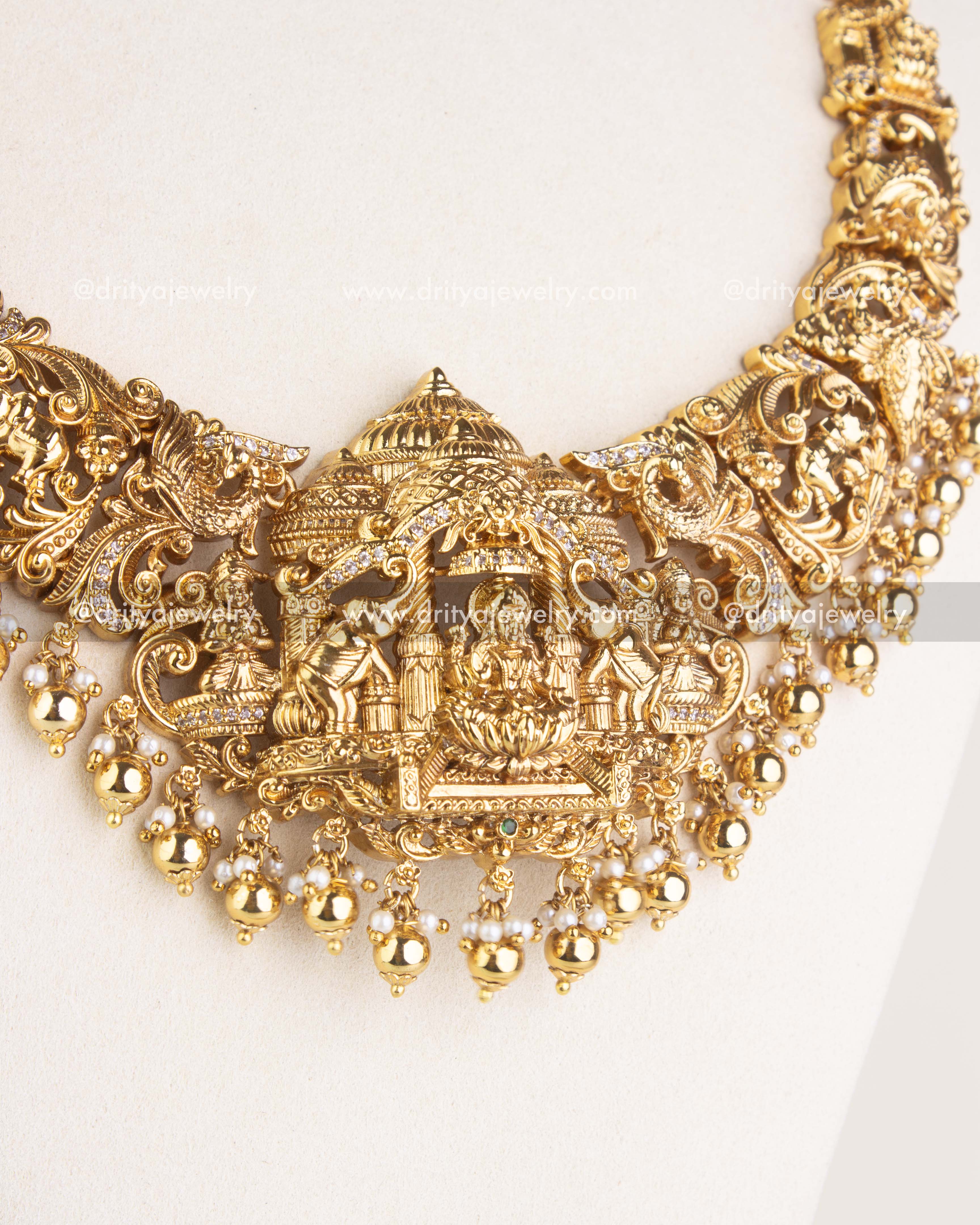SKU 1124 - Necklace Set - Detailed view of central god idol pendant with layered bead drops on necklace.