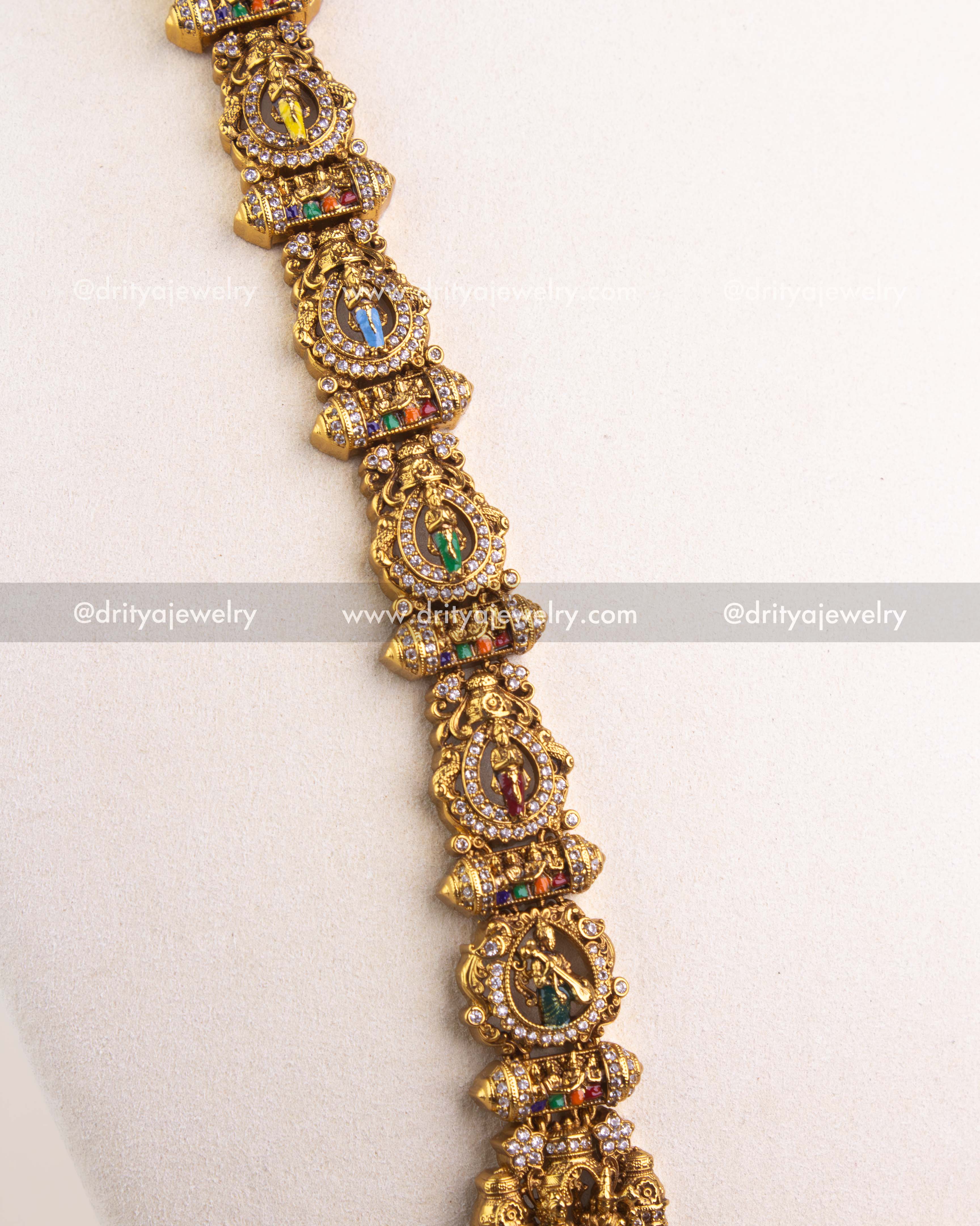 Side view of deity-studded long necklace chain in gold-plated temple style