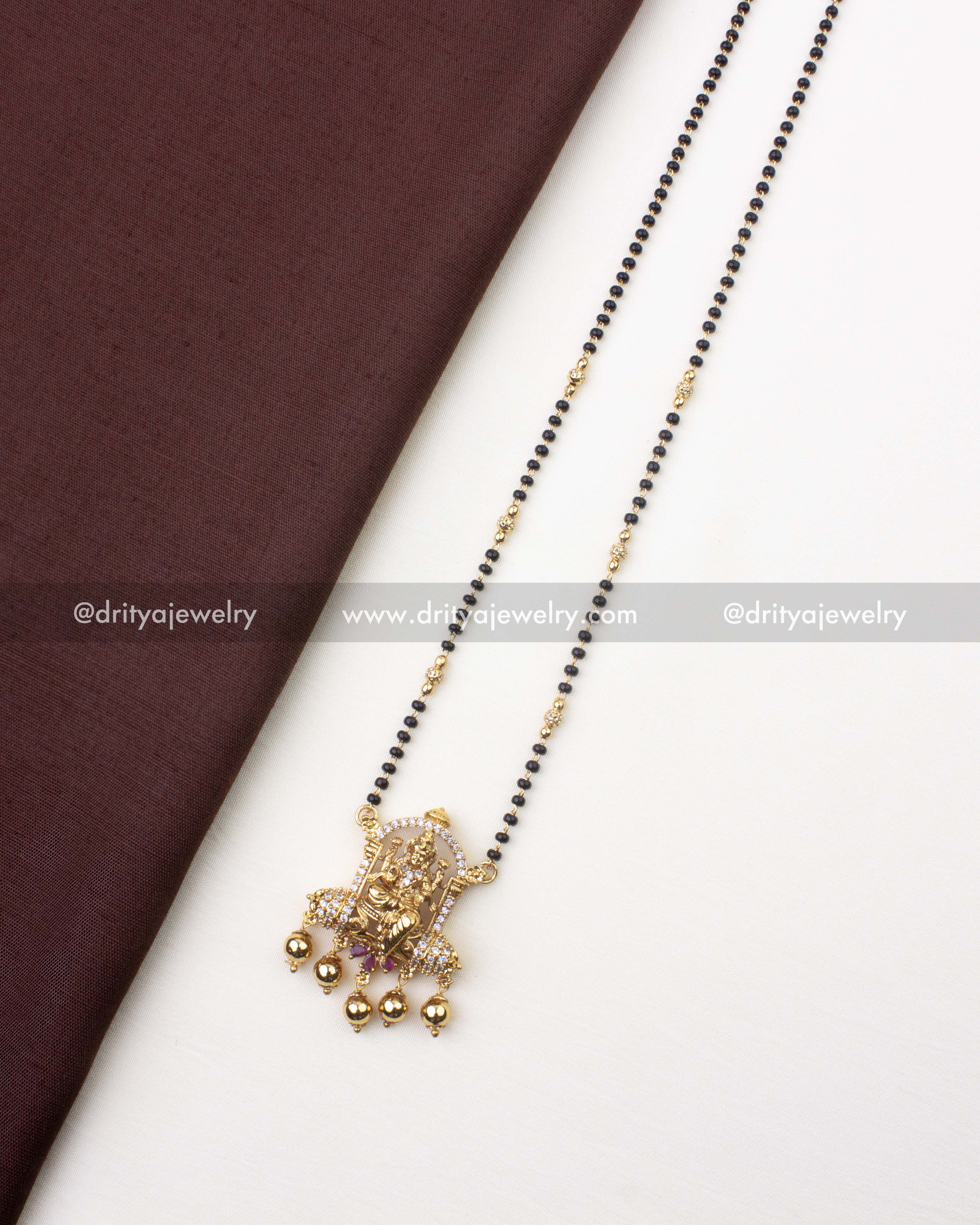1222 - Full view of premium temple god idol black beads necklace laid flat
