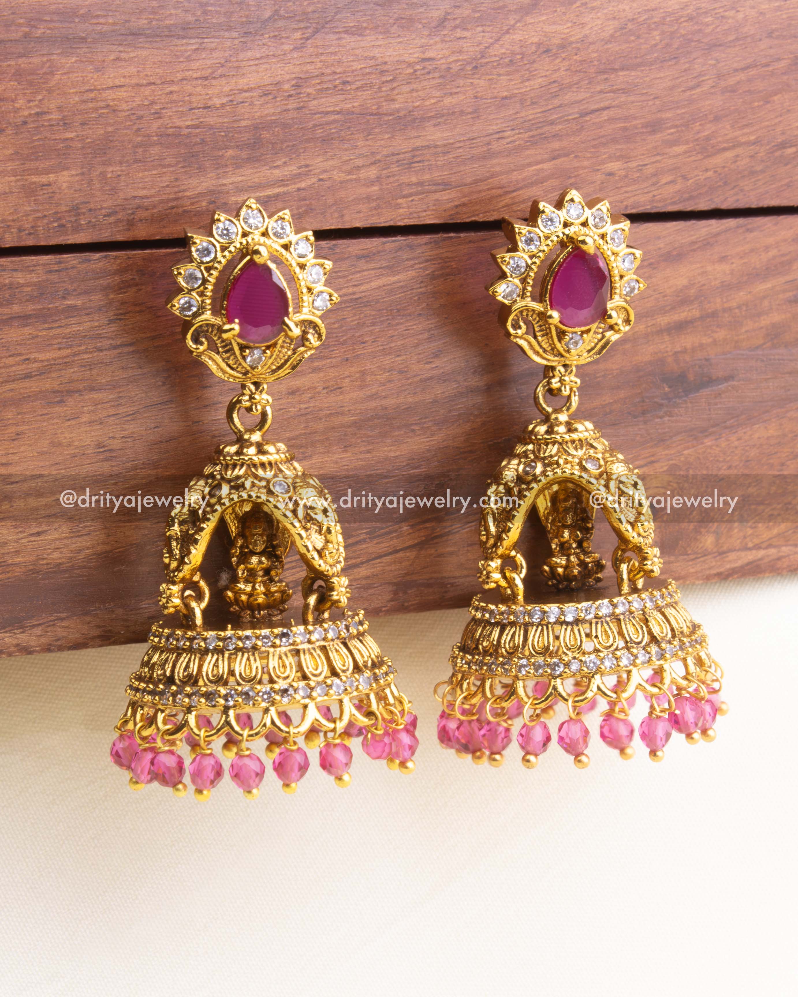 SKU 1175 premium Lakshmi temple jhumka earrings with ruby pink stones and pink bead drops front view