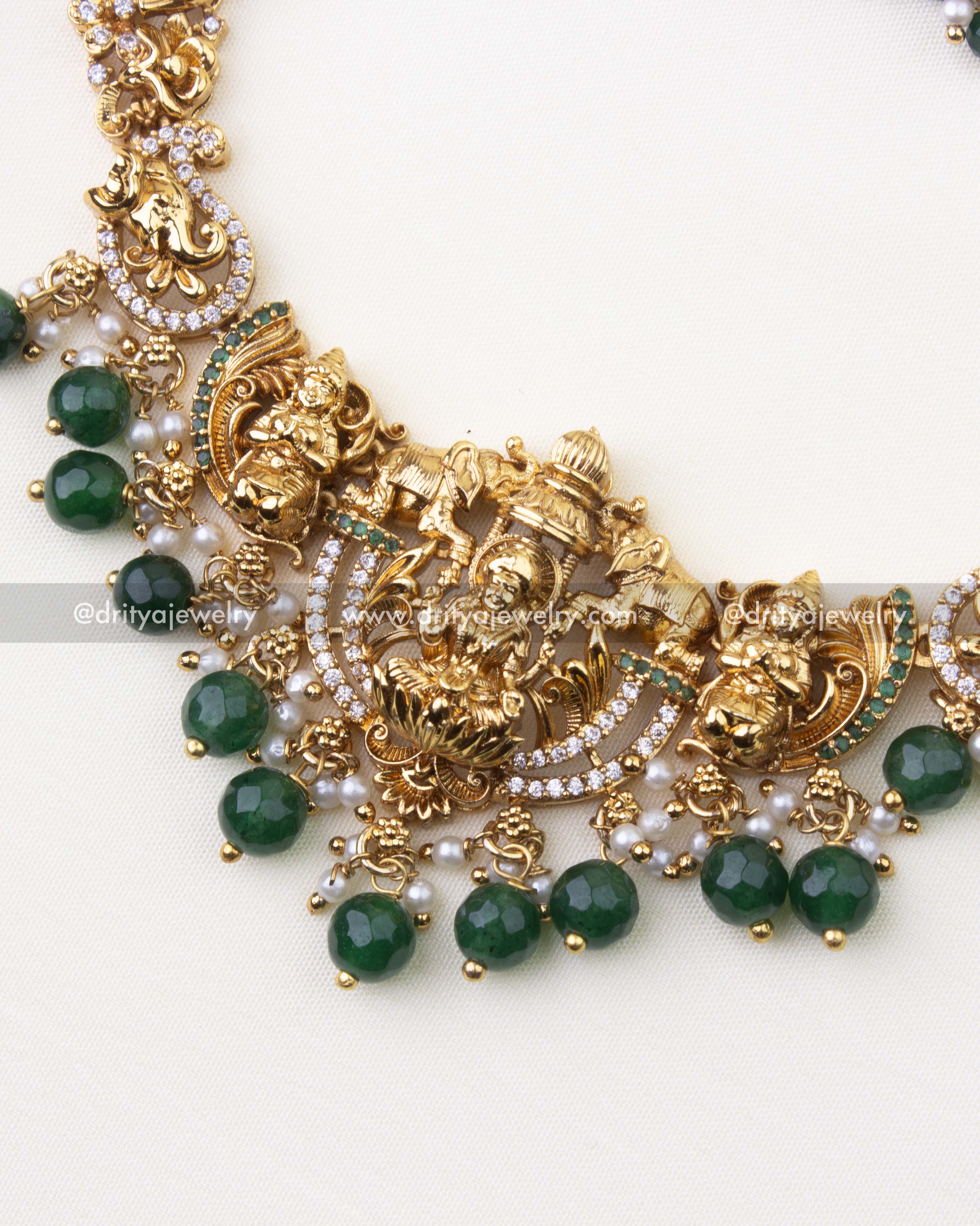 1101-G close-up of Lakshmi Devi pendant with stone-studded arcs and green bead drops