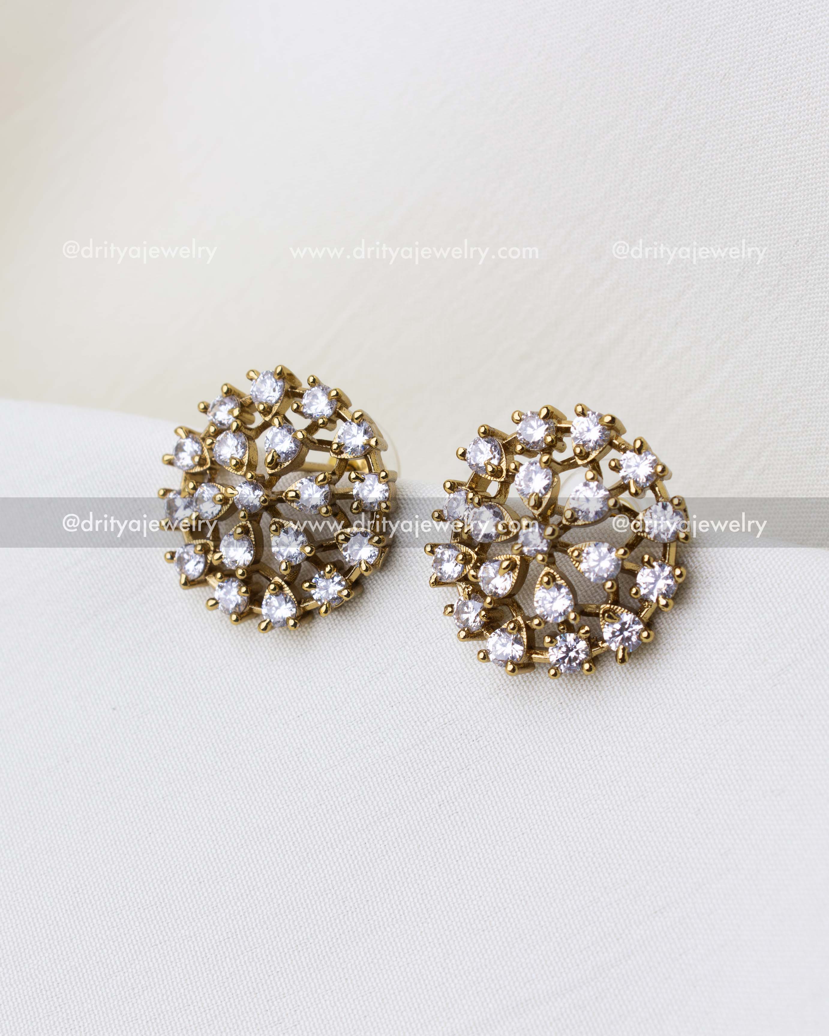 SKU 1304 - Close-up of round floral CZ stud earrings in light gold finish