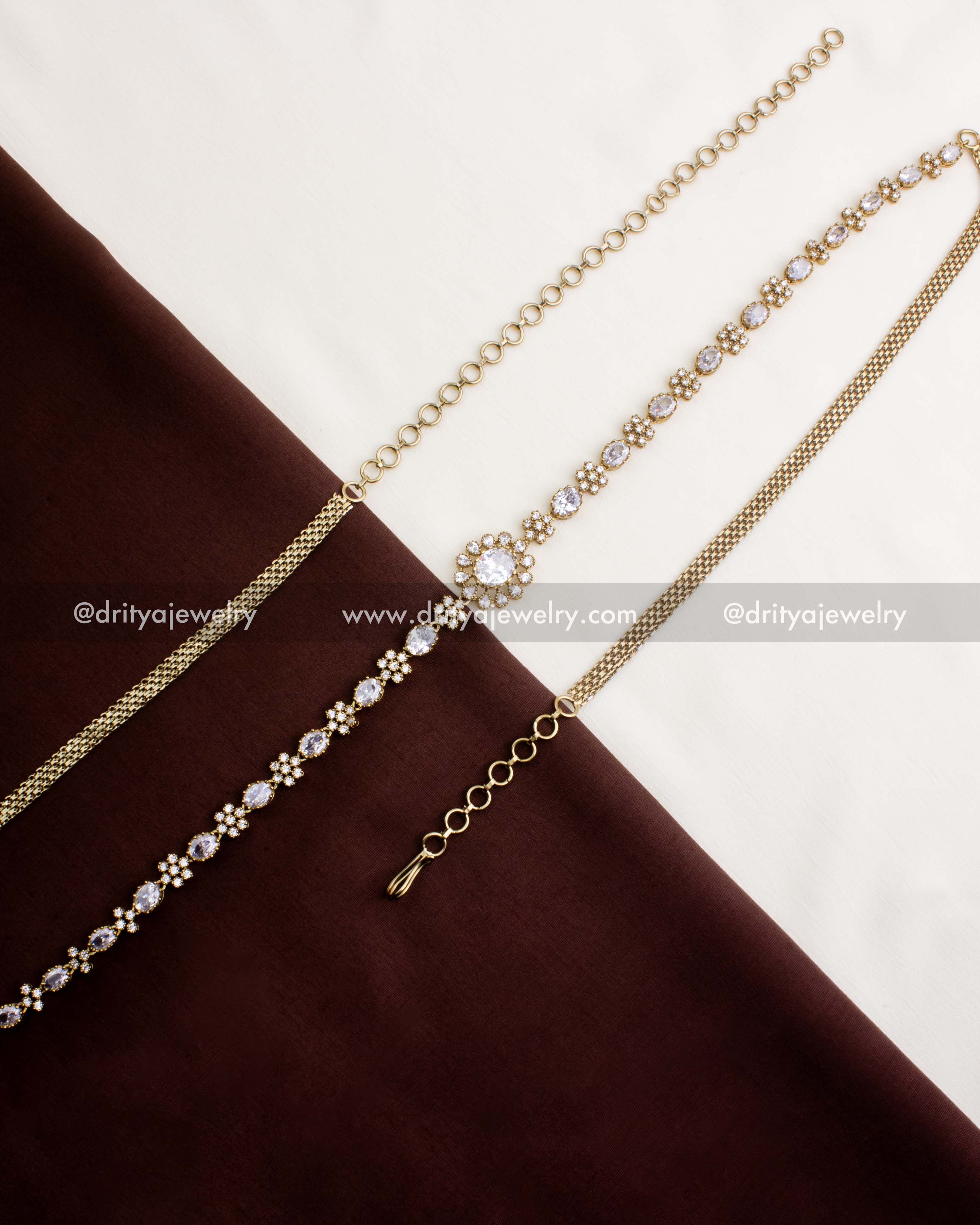 1109-W full Victorian CZ stone hip chain with adjustable links laid flat on fabric