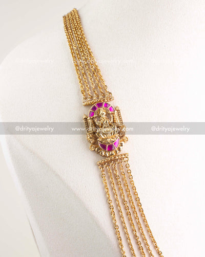 Layered gold-plated temple chandraharam necklace with pink stone deity pendant close-up view