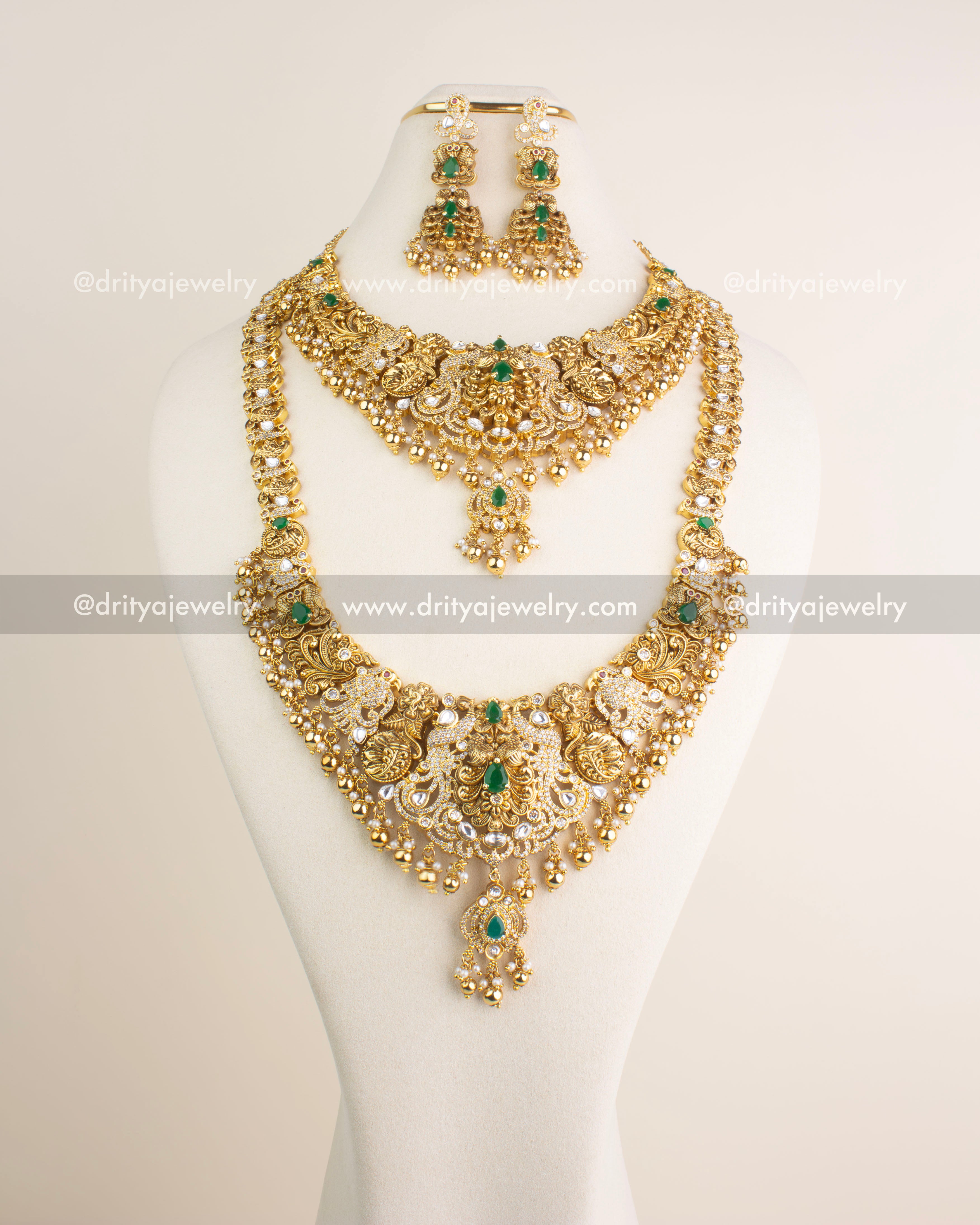 Full view of the premium antique combo set including long necklace, short necklace, and danglers, adorned with kundan work and green stones.