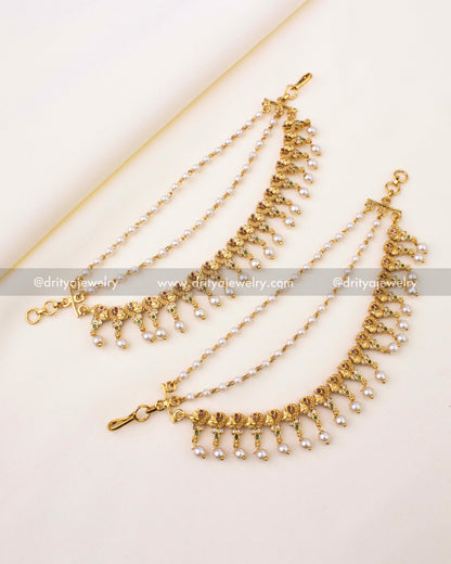 Antique gold champaswaralu featuring floral motifs, CZ stones, and pearl drops.