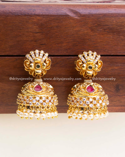 Traditional antique jhumka earrings with CZ stones, ruby accents, and pearl danglers - no deity design.