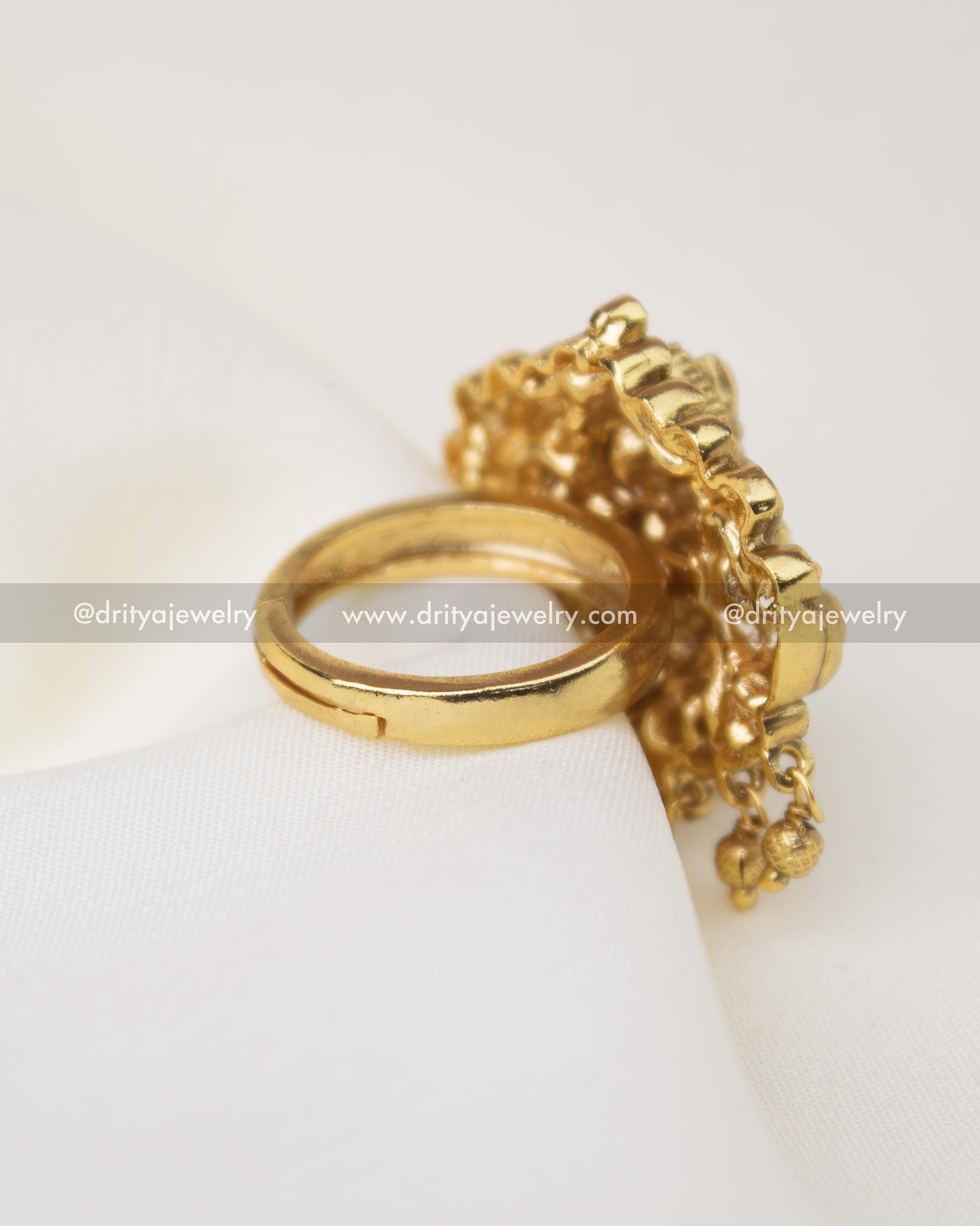 South Indian temple style statement ring with floral detailing and antique gold finish