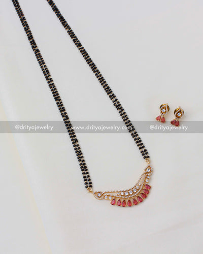 Elegant black beads necklace set with double-line chain and red stone pendant.